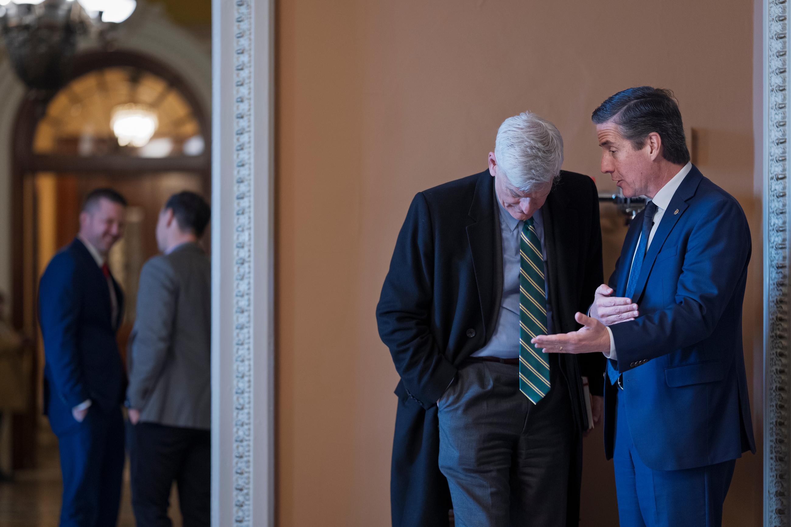 Senate Health, Education, Labor, and Pensions Committee Chair Bill Cassidy listens to Sen. Bernie Moreno at the Capitol on Wednesday. (AP Photo/J. Scott Applewhite)