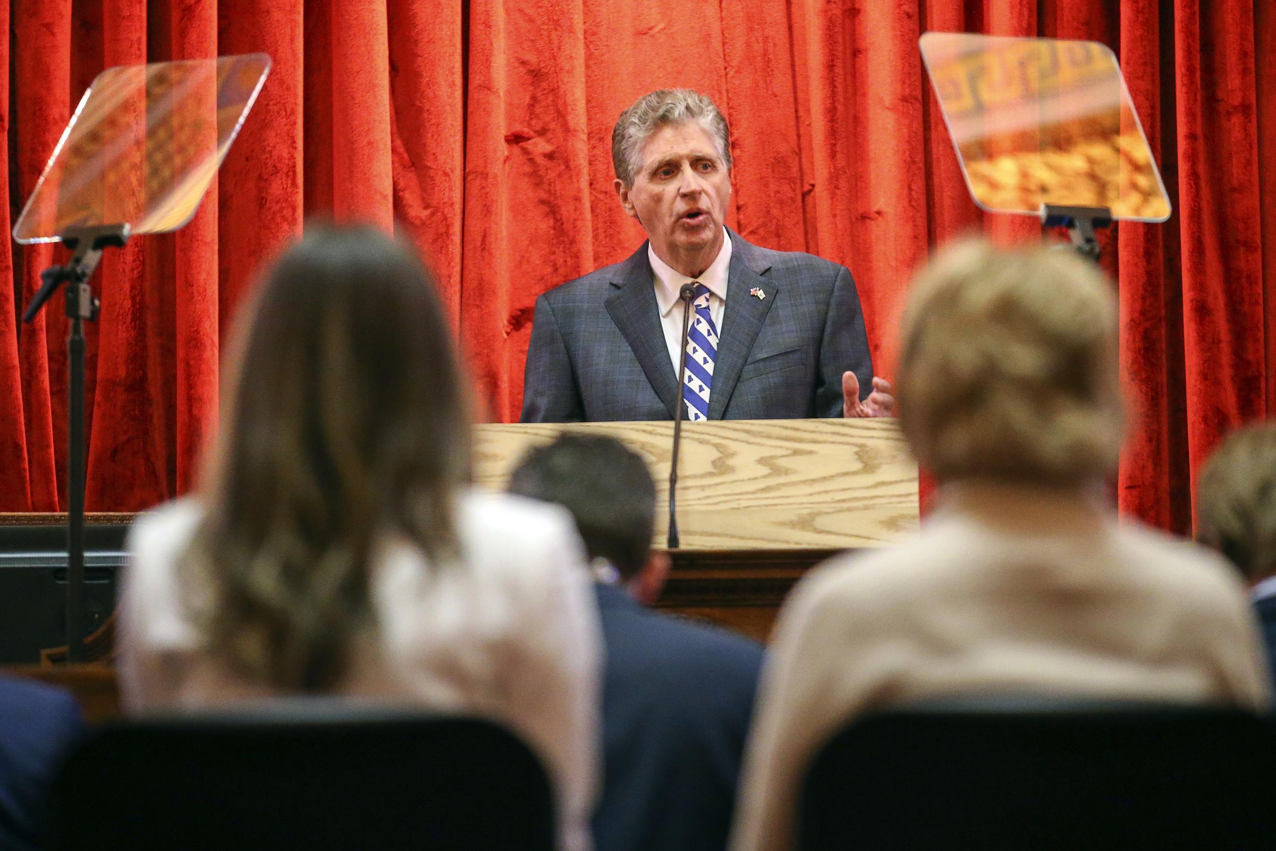 Rhode Island Democratic Gov. Dan McKee delivers his State of the State address to lawmakers and guests in the House Chamber at the Statehouse, Tuesday, Jan. 18, 2022, in Providence, R.I. (AP Photo/Stew Milne)