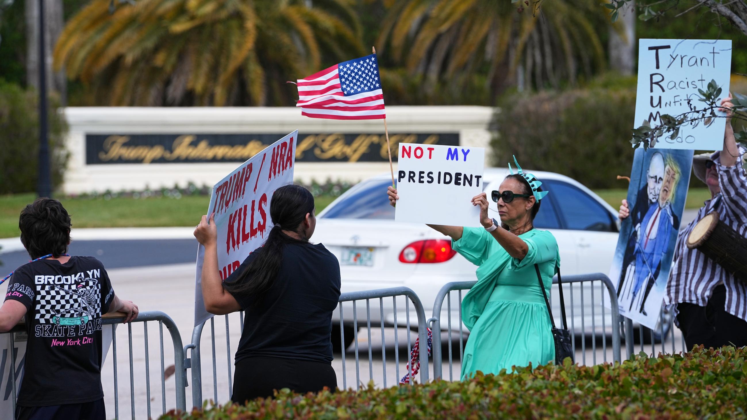 Protesters across the street from the entrance to Trump International Golf Club, in West Palm Beach, Fla., on Feb. 15 (AP Photo/Matt Rourke)