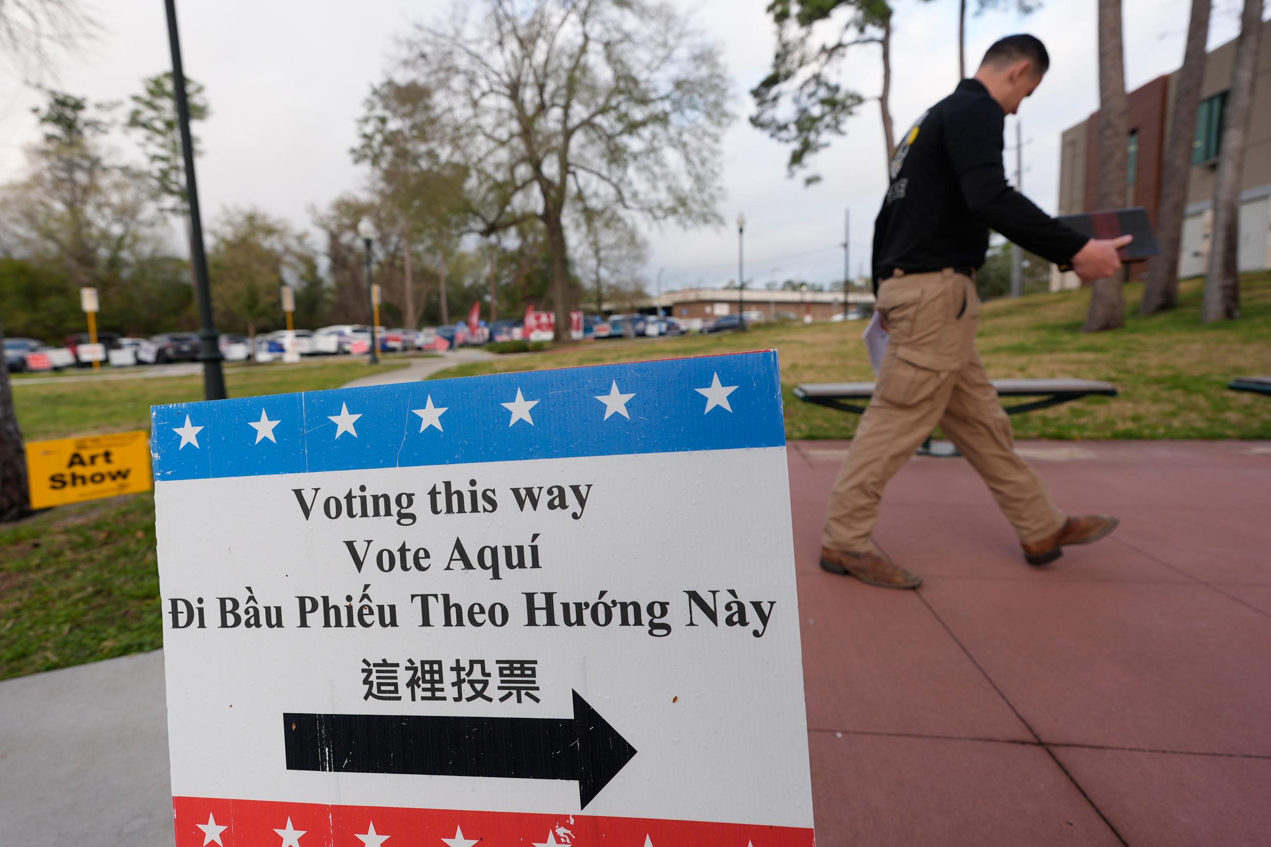 A voter makes his way into a polling location, Tuesday, March 3, 2026, in Spring, Texas. (AP Photo/David J. Phillip)