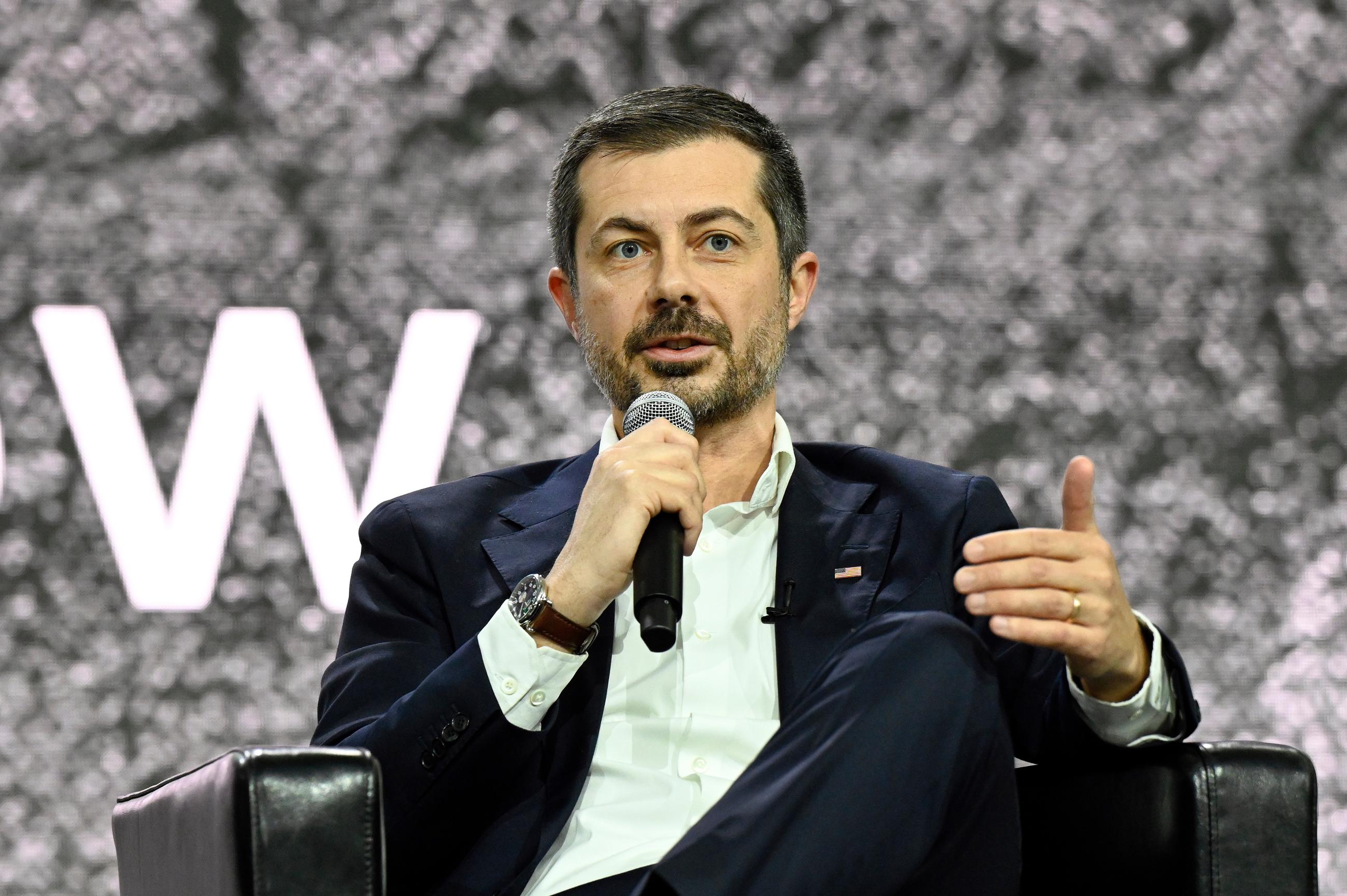 Former Transportation Secretary Pete Buttigieg addresses the audience during a talk at the Detroit Auto Show, Wednesday, Jan. 14, 2026, in Detroit. (AP Photo/Jose Juarez)