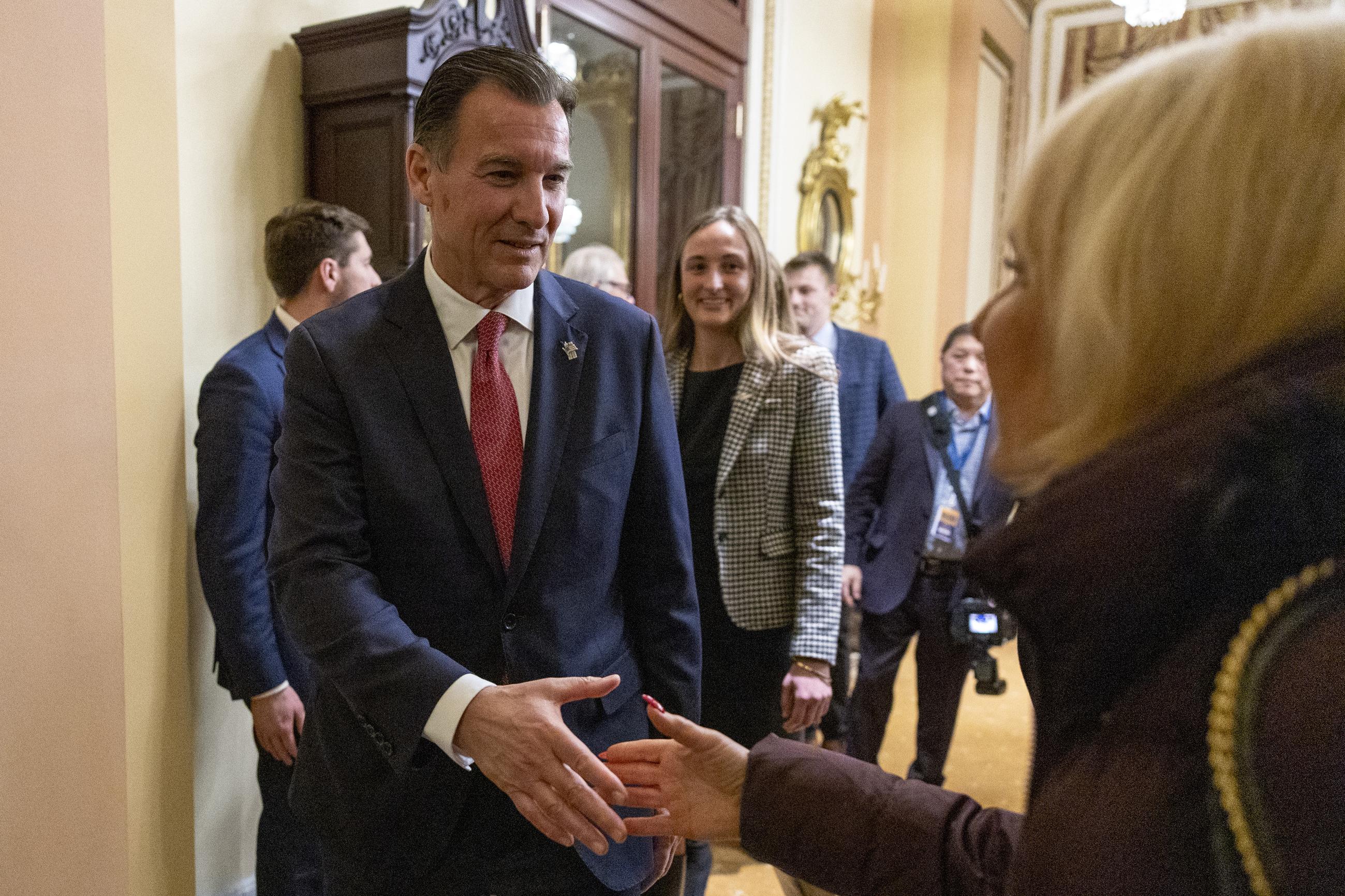 Rep. Tom Suozzi, D-N.Y., shakes hands after a ceremonial swearing-in the Capitol in Washington, Wednesday, Feb. 28, 2024. (AP Photo/Amanda Andrade-Rhoades)
