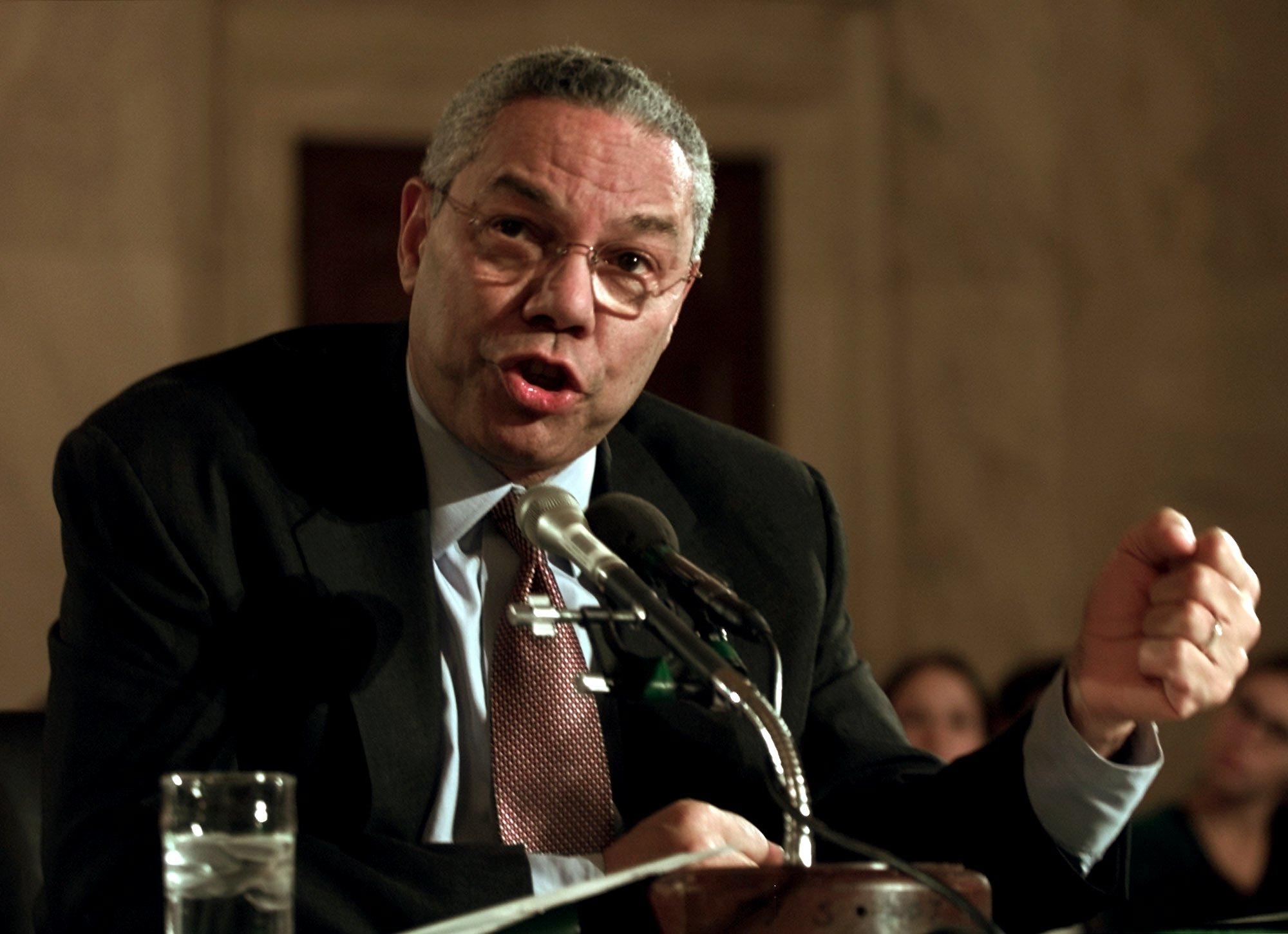 Secretary of State Colin Powell shakes his fist during testimony before the Senate Foreign Relations Committee on Oct. 25, 2001. (AP Photo/Joe Marquette)