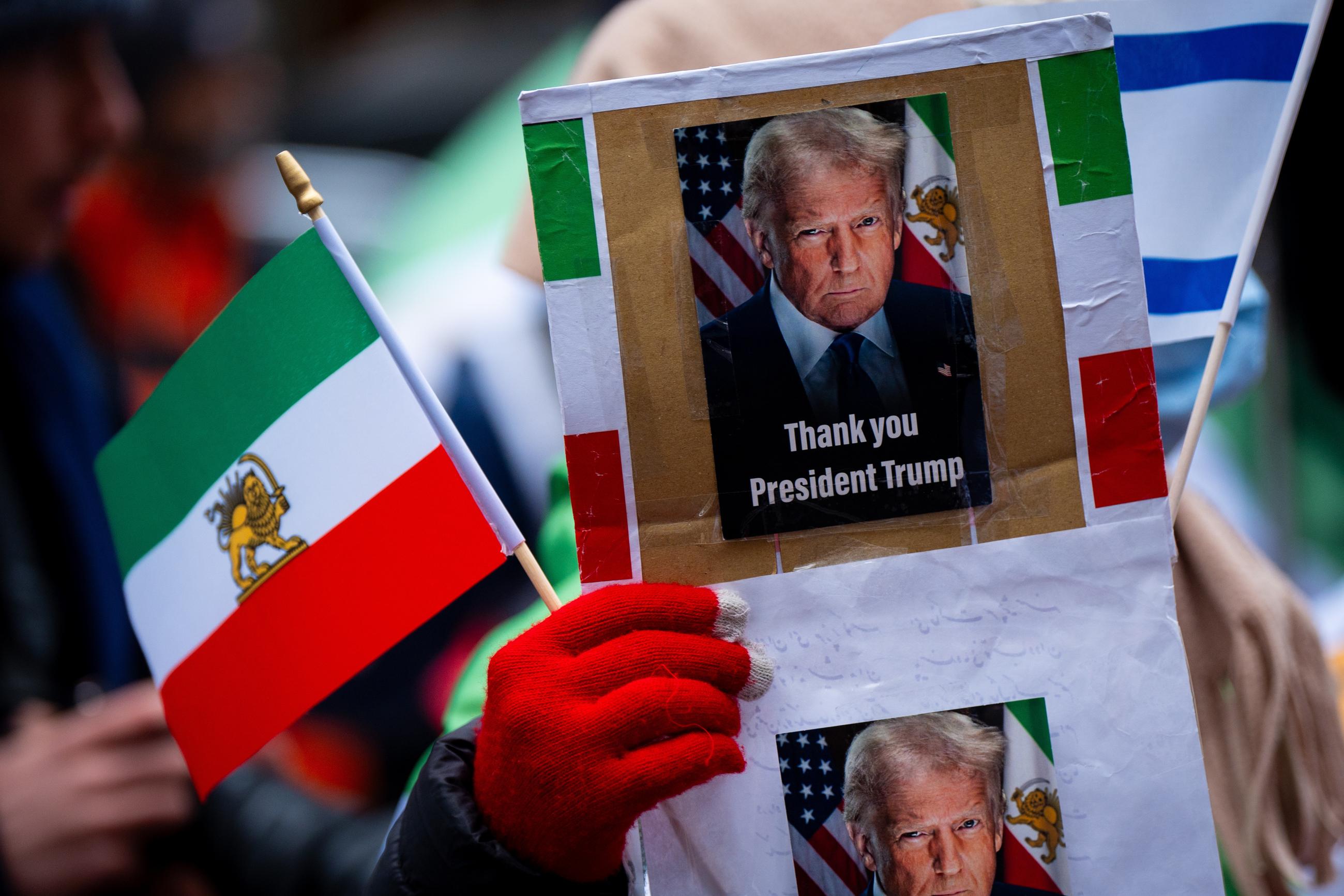 A protester in New York City on Sunday holds a poster at a demonstration hosted by Lion Sun NY in support of the U.S. and Israeli actions against the Iranian government. (AP Photo/Angelina Katsanis)