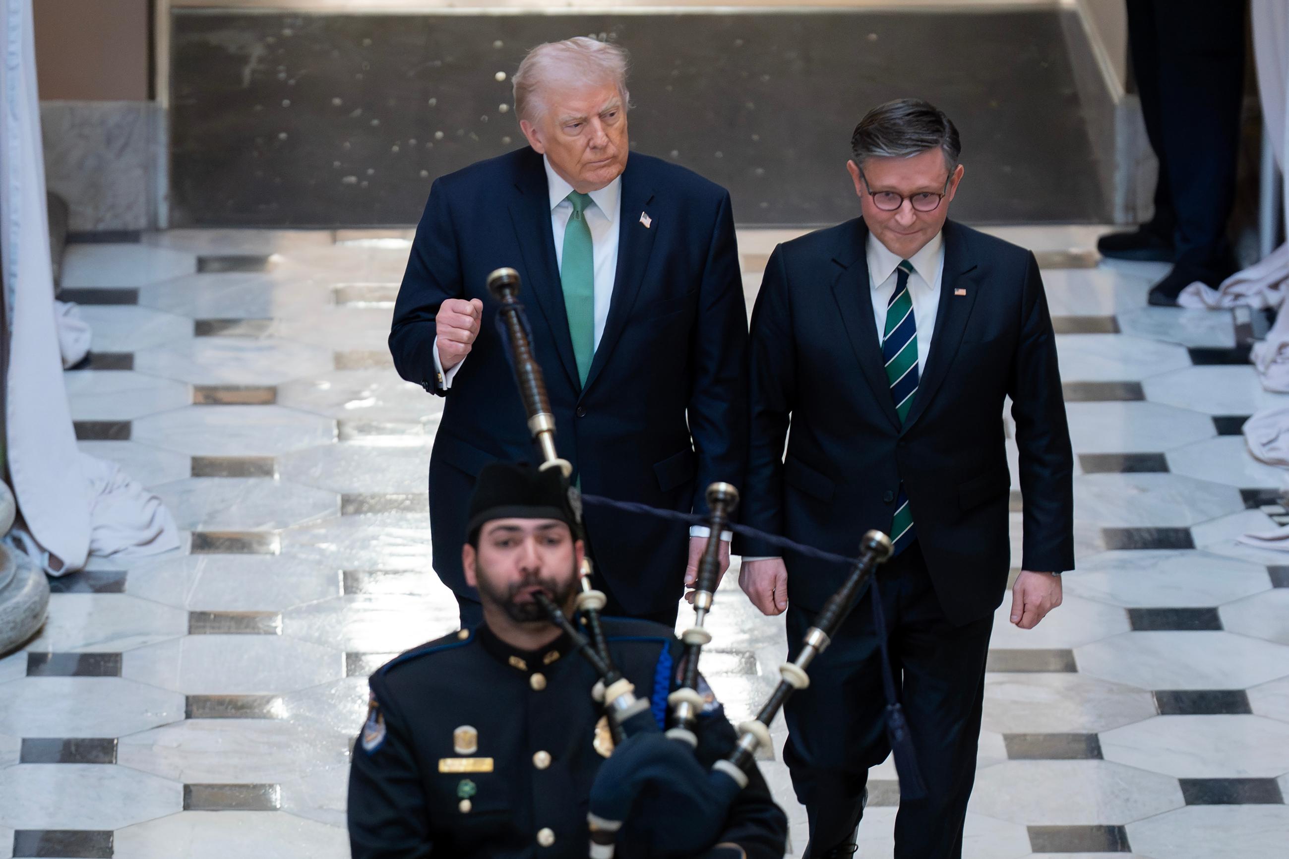 President Donald Trump and Speaker of the House Mike Johnson, R-La., depart the U.S. Capitol, on St. Patrick's Day, Tuesday, March 17, 2026, in Washington. (AP Photo/Jose Luis Magana)