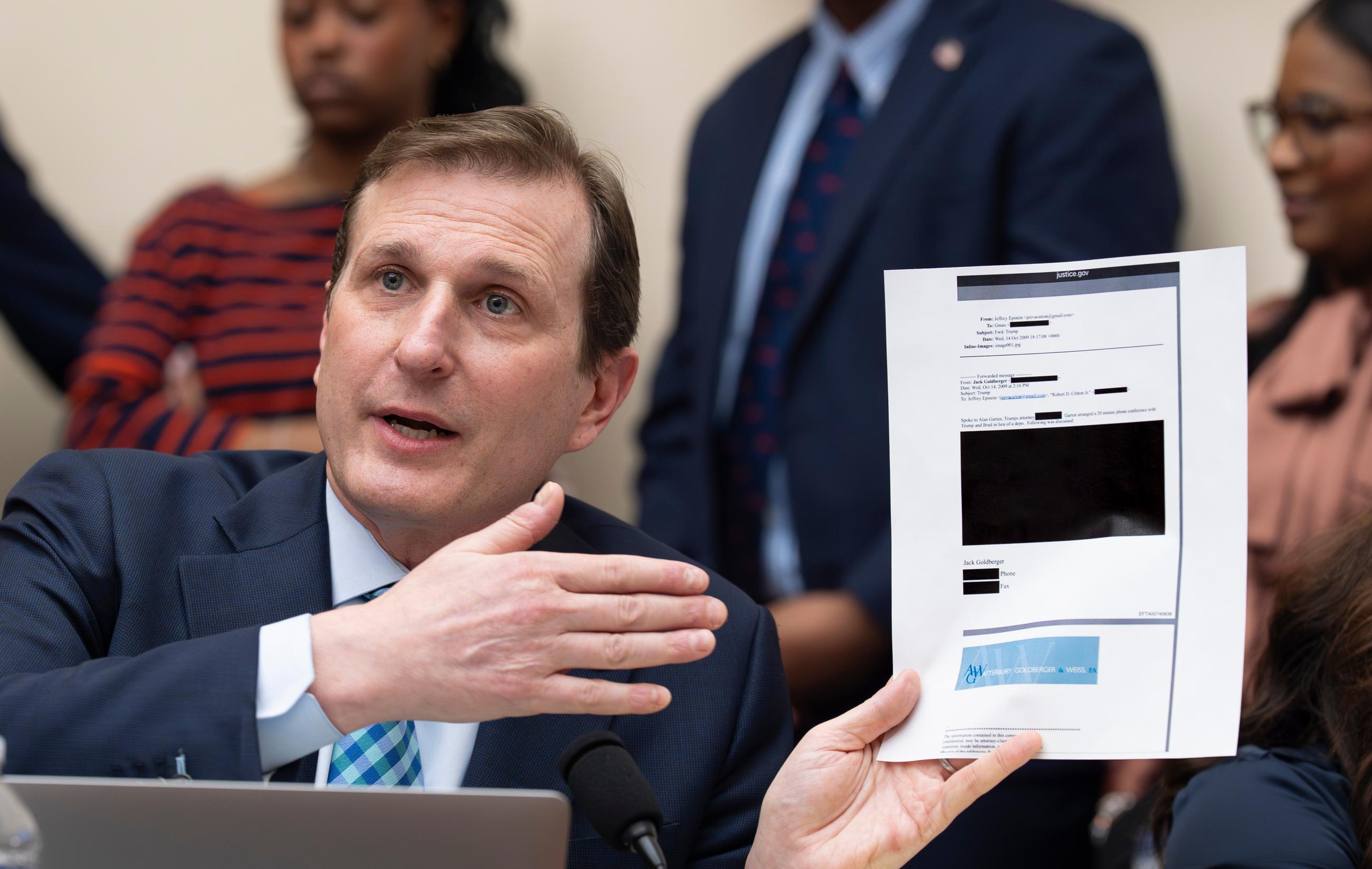 Rep. Dan Goldman, D-N.Y., holds up a redacted email as he questions Attorney General Pam Bondi in the House Judiciary Committee at the Capitol in Washington, Wednesday, Feb. 11, 2026. (AP Photo/J. Scott Applewhite)