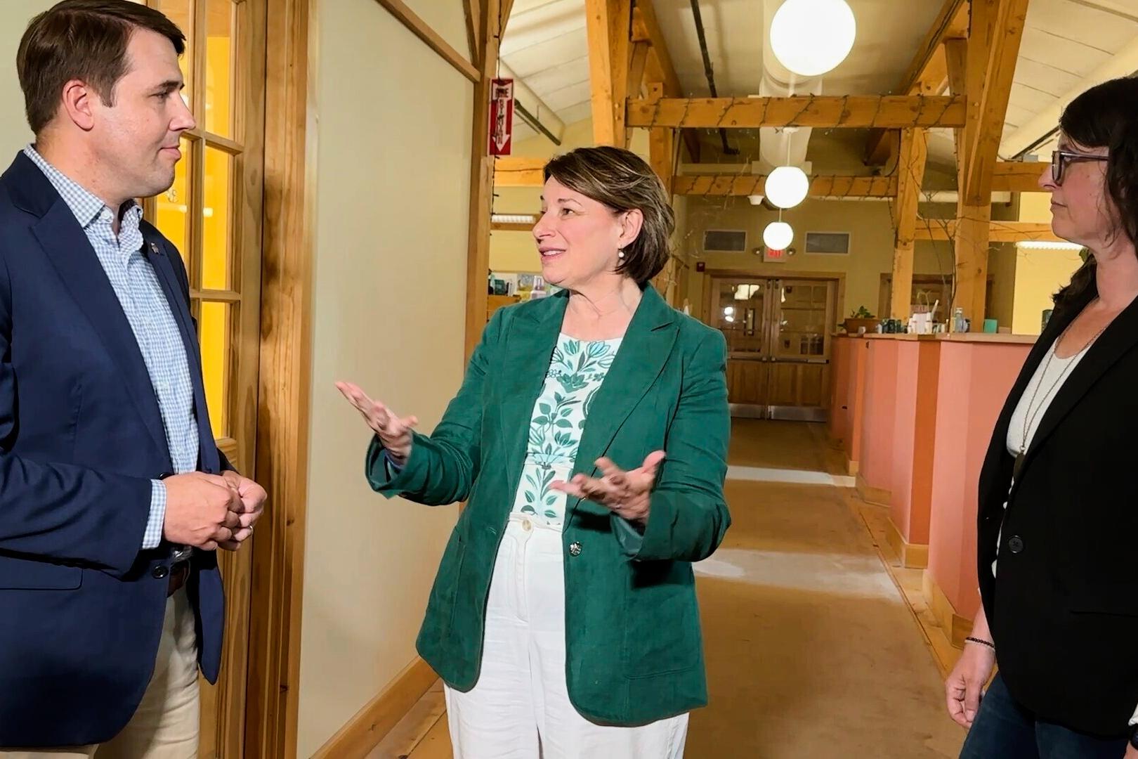 Sen. Amy Klobuchar of Minnesota in Gilsum, N.H., with Rep. Chris Pappas in July 2025 (AP Photo/Holly Ramer)