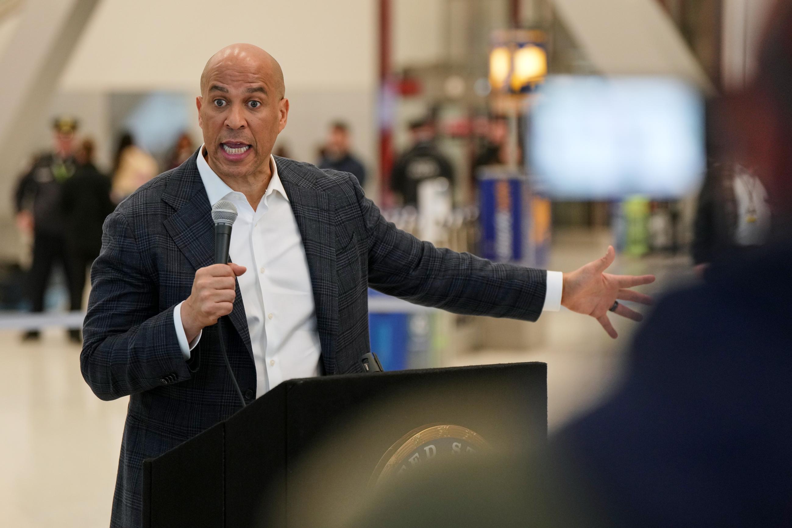 Sen. Cory Booker, D-N.J., speaks during a news conference at Newark Liberty International Airport, Monday, March 23, 2026, in Newark, N.J. (AP Photo/Angelina Katsanis)