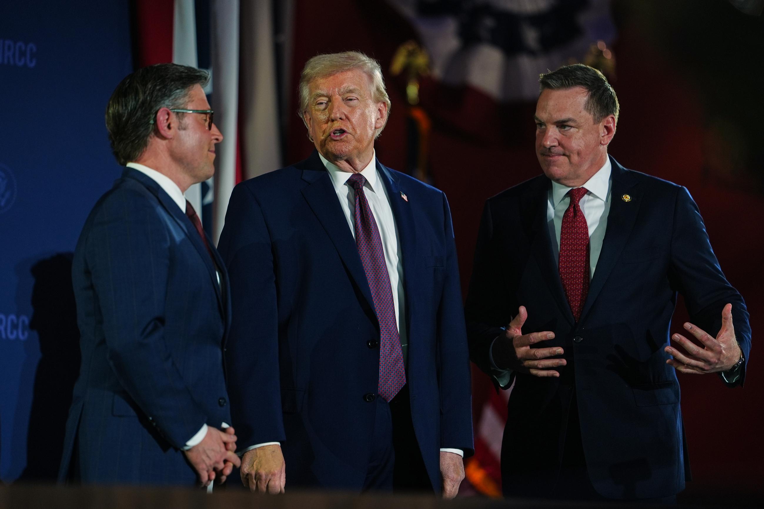 President Trump talks with House Speaker Mike Johnson and National Republican Congressional Committee Chair Richard Hudson on March 25 (AP Photo/Julia Demaree Nikhinson)