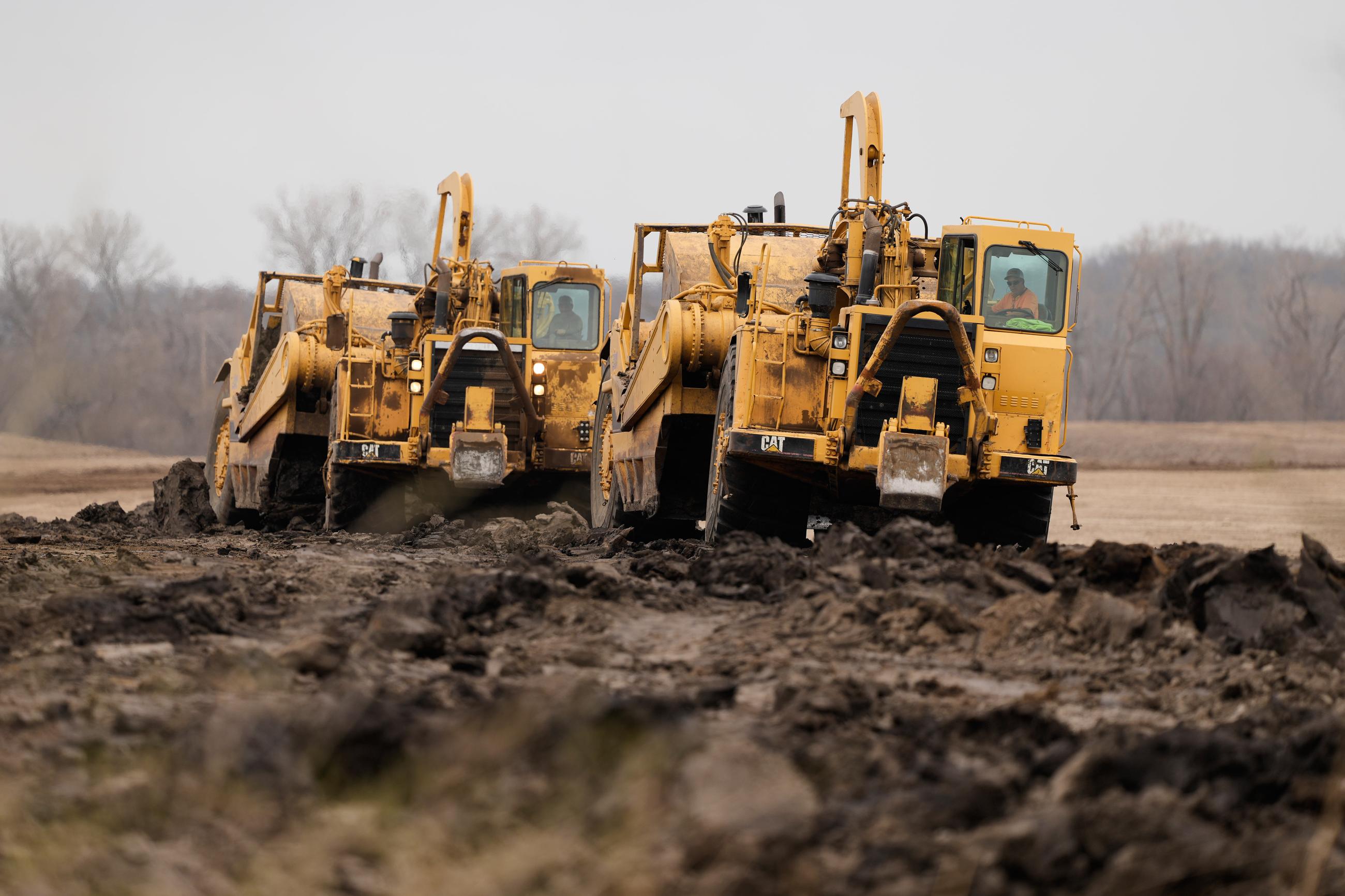 Earth movers prepare a site for a 2.5 million square foot AI data center in Independence, Mo., on March 24. (AP Photo/Charlie Riedel)