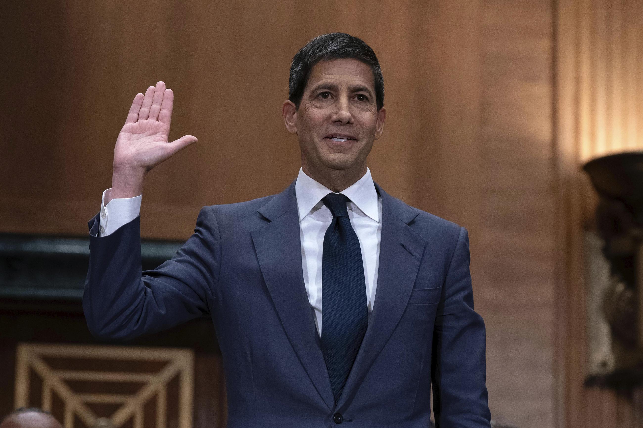 Kevin Warsh is sworn in during his nomination hearing to be a member and chairman of the Federal Reserve Board of Governors before the Senate Banking, Housing, and Urban Affairs Committee on April 21. (AP Photo/Jose Luis Magana)