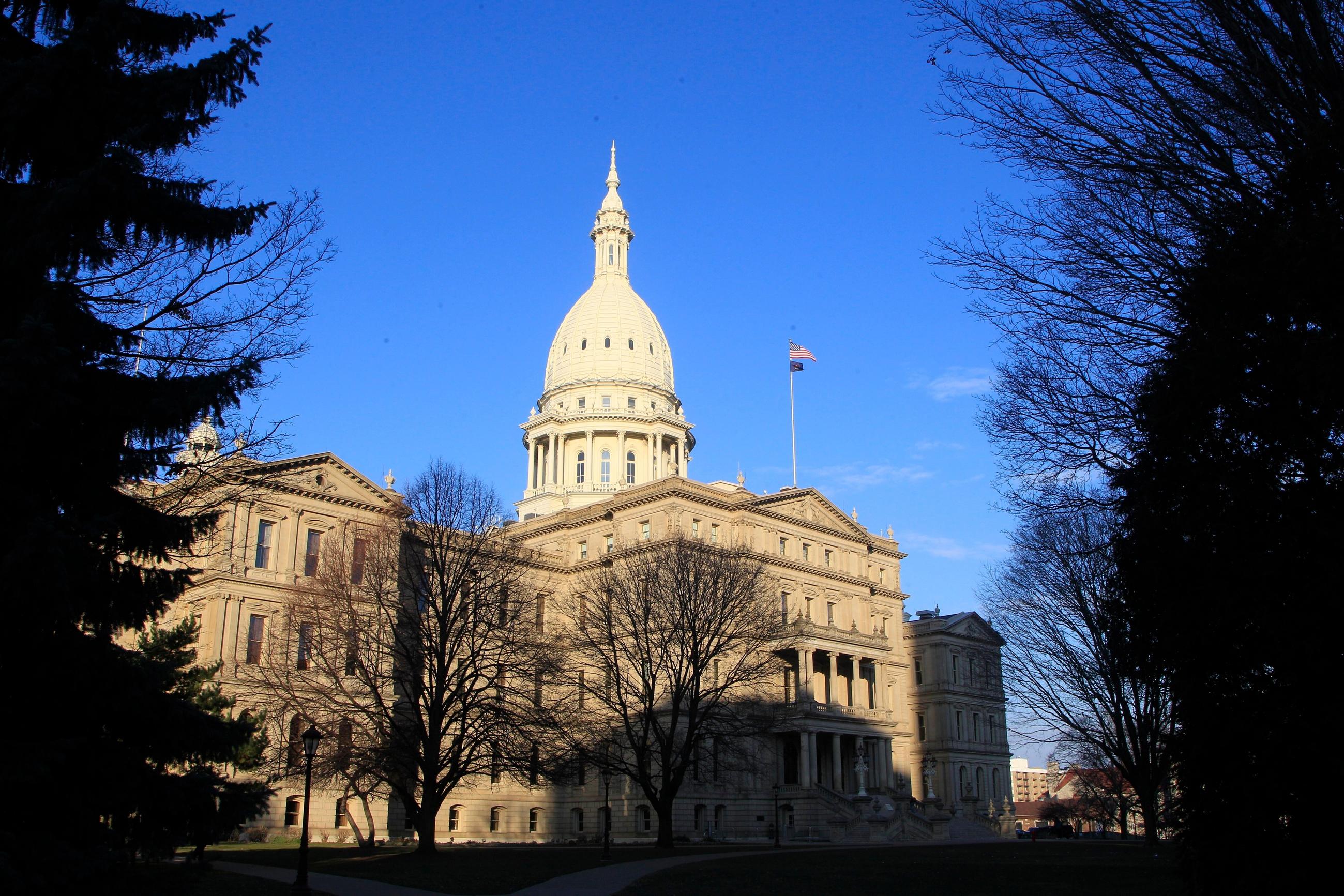 FILE - The state Capitol building is seen on Dec. 12, 2012, in Lansing, Mich. (AP Photo/Carlos Osorio, File)