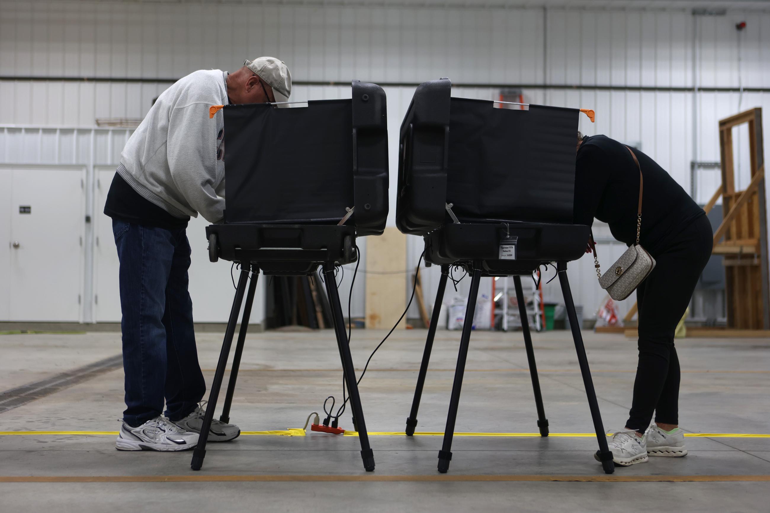 Donna Wooten, right, votes across from her husband, Jerry Wooten in a vote center during a primary election on Tuesday, May 5, 2026, in West Lafayette, Ind. (AP Photo/Cara Penquite)