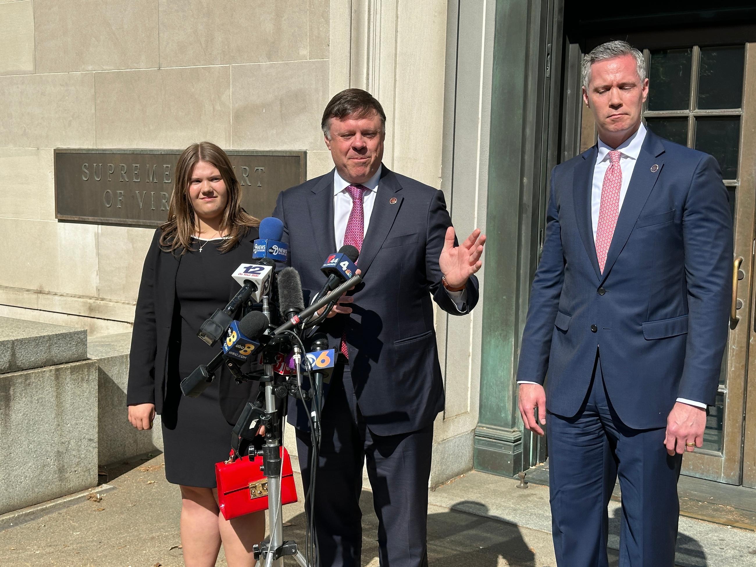 State Senate Minority Leader Ryan McDougle, center, speaks outside the Supreme Court of Virginia after arguments were heard in a redistricting-related case at the court in Richmond, Va., on Monday, April 27, 2026. (AP Photo/Allen G. Breed)
