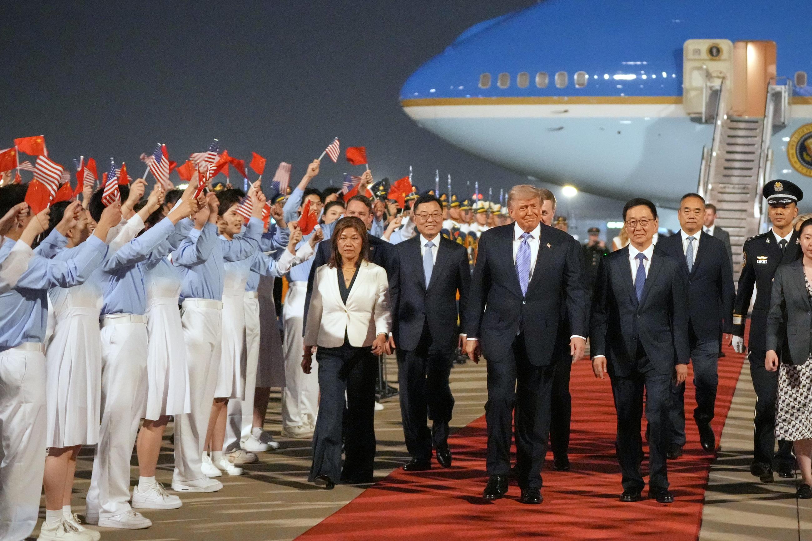President Trump walks with Chinese Vice President Han Zheng during a welcome ceremony at Beijing Capital International Airport on Wednesday. (AP Photo/Mark Schiefelbein)
