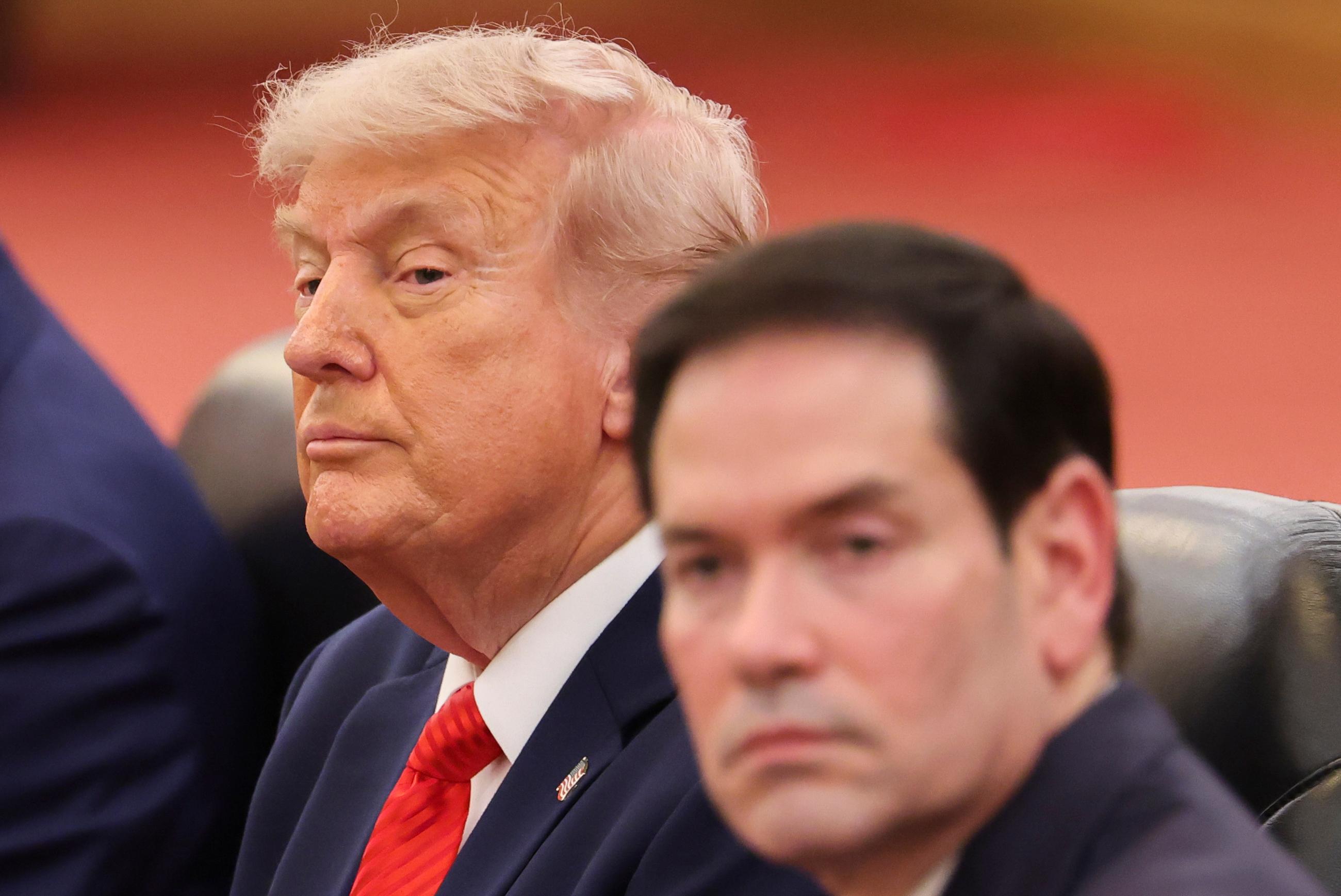 U.S. President Donald Trump, left, seated next to U.S. Secretary of State Marco Rubio, right, attends a bilateral meeting with Chinese President Xi Jinping at the Great Hall of the People in Beijing, Thursday, May 14, 2026. (Maxim Shemetov/Pool Photo via AP)