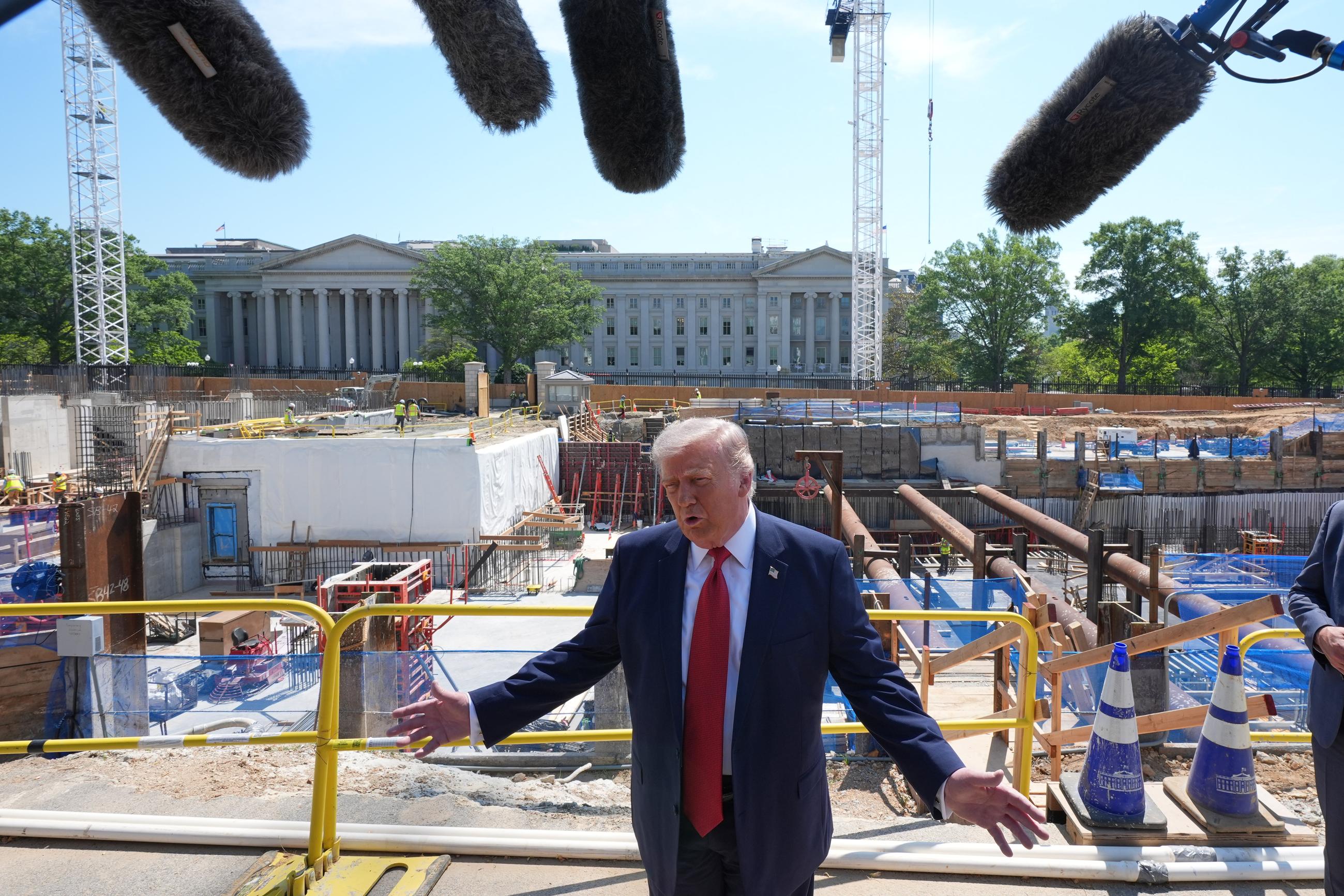 President Trump speaks as he tours ballroom construction around the outside of the White House on Tuesday. (AP Photo/Jacquelyn Martin)