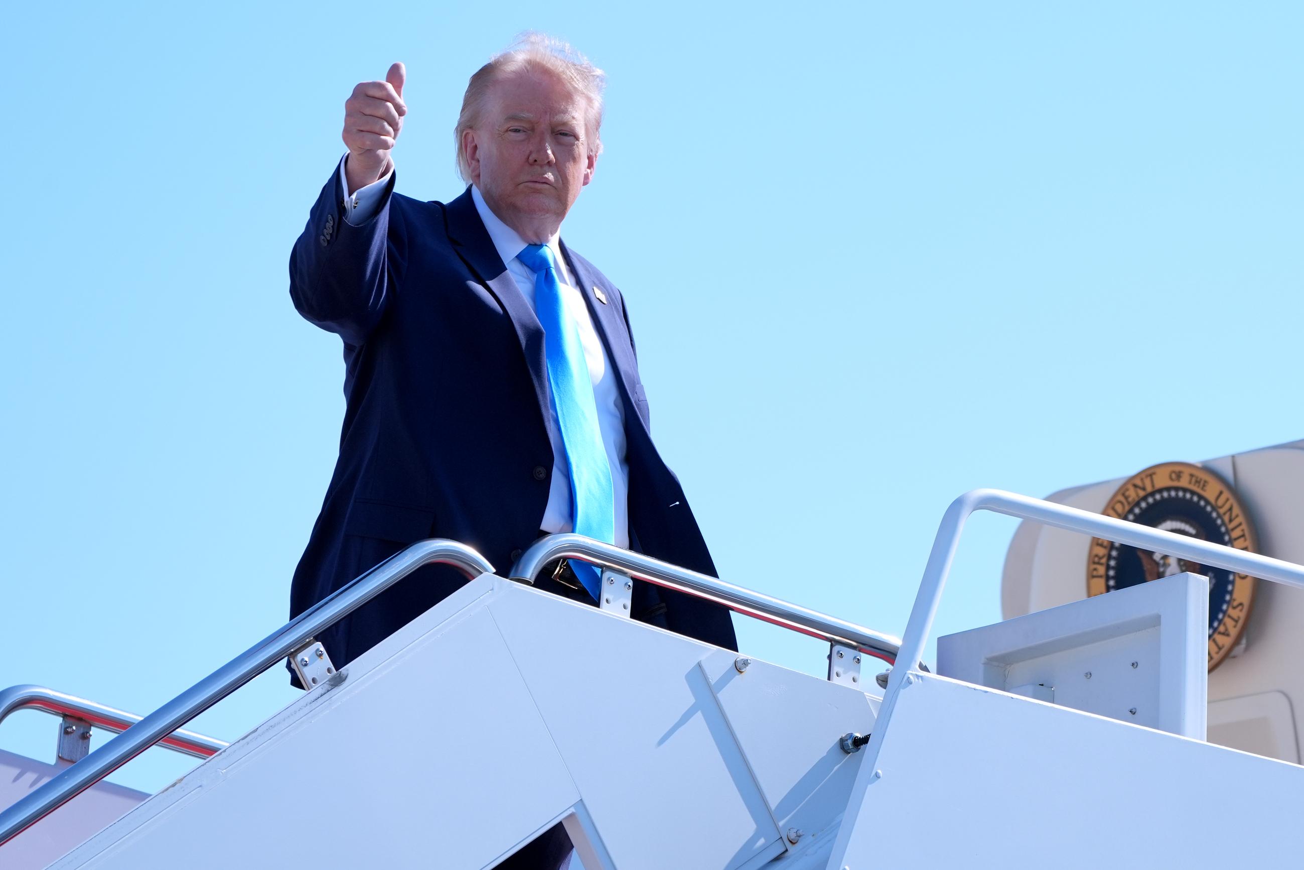 President Donald Trump boards Air Force One, Wednesday, May 20, 2026, at Joint Base Andrews, Md., en route to speak at the U.S. Coast Guard Academy commencement. (AP Photo/Jacquelyn Martin)