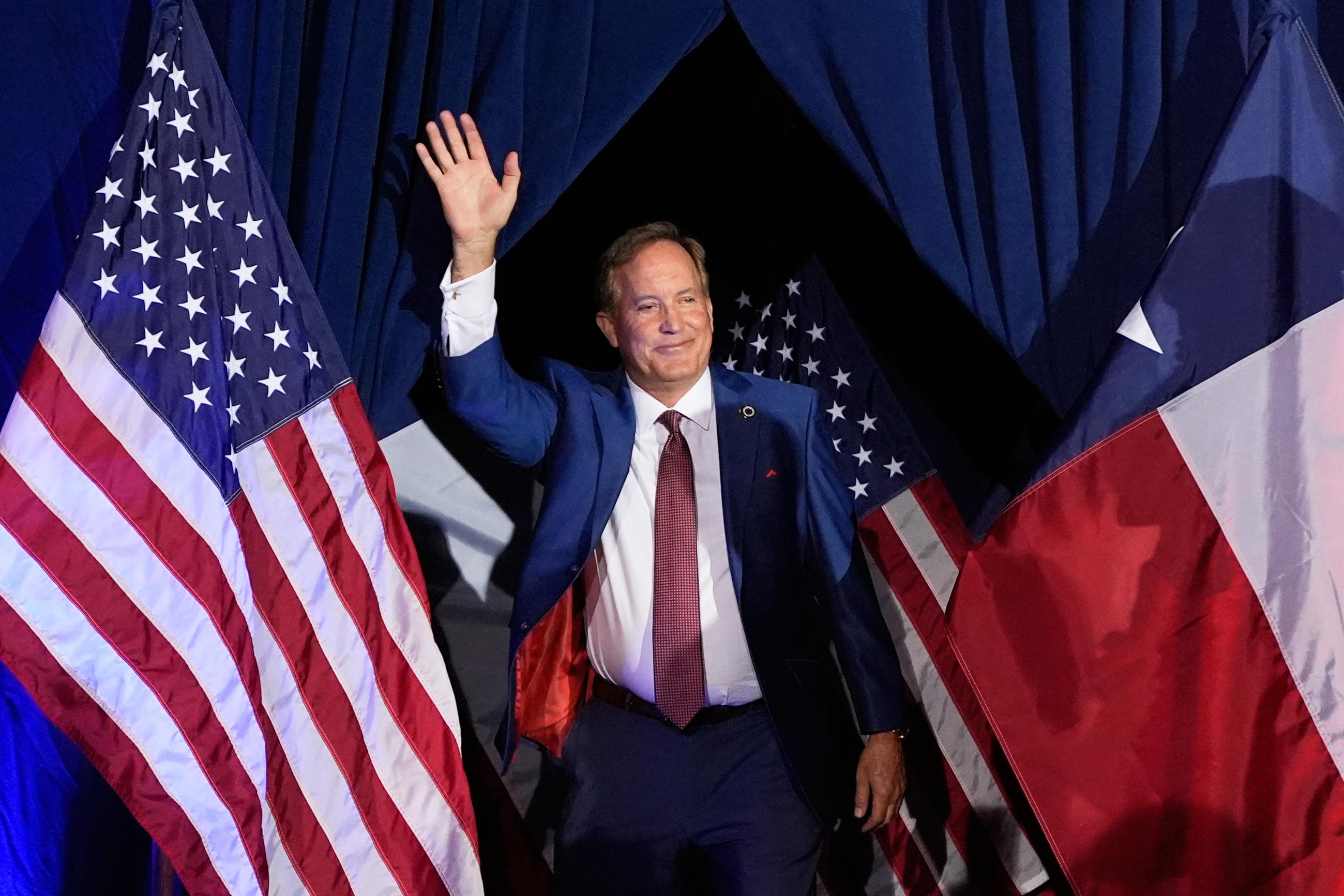 Texas Attorney General Ken Paxton, a Republican candidate for the U.S. Senate, waves as he takes the stage during a primary runoff election night event after winning the Republican party's nomination Tuesday, May 26, 2026, in Plano, Texas. (AP Photo/Tony Gutierrez)