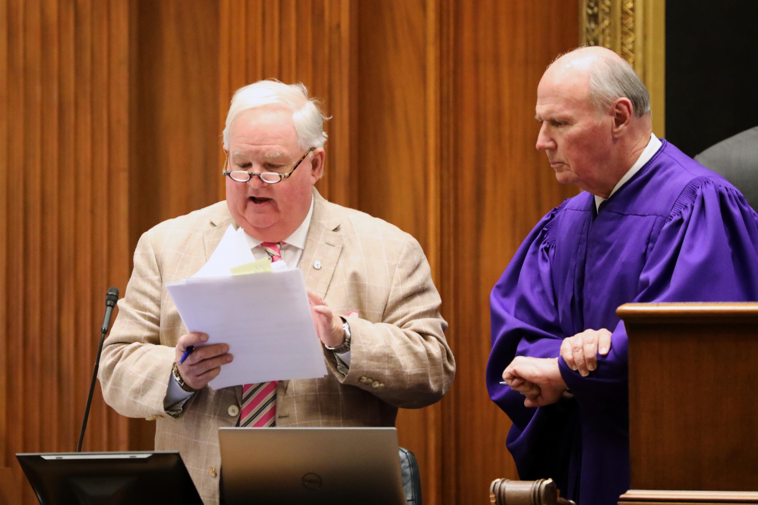 South Carolina Senate Clerk John Wienges, left, sifts through amendments as Republican Senate President Thomas Alexander, right, looks on during the redistricting debate on Thursday, May 21, 2026, in Columbia, S.C. (AP Photo/Jeffrey Collins)
