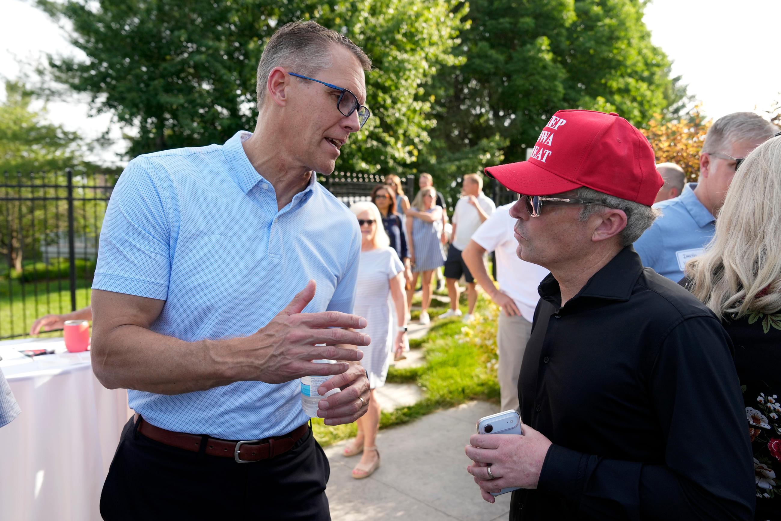 Rep. Randy Feenstra (left) at a rally in West Des Moines, Iowa, on May 27 (AP Photo/Charlie Neibergall)