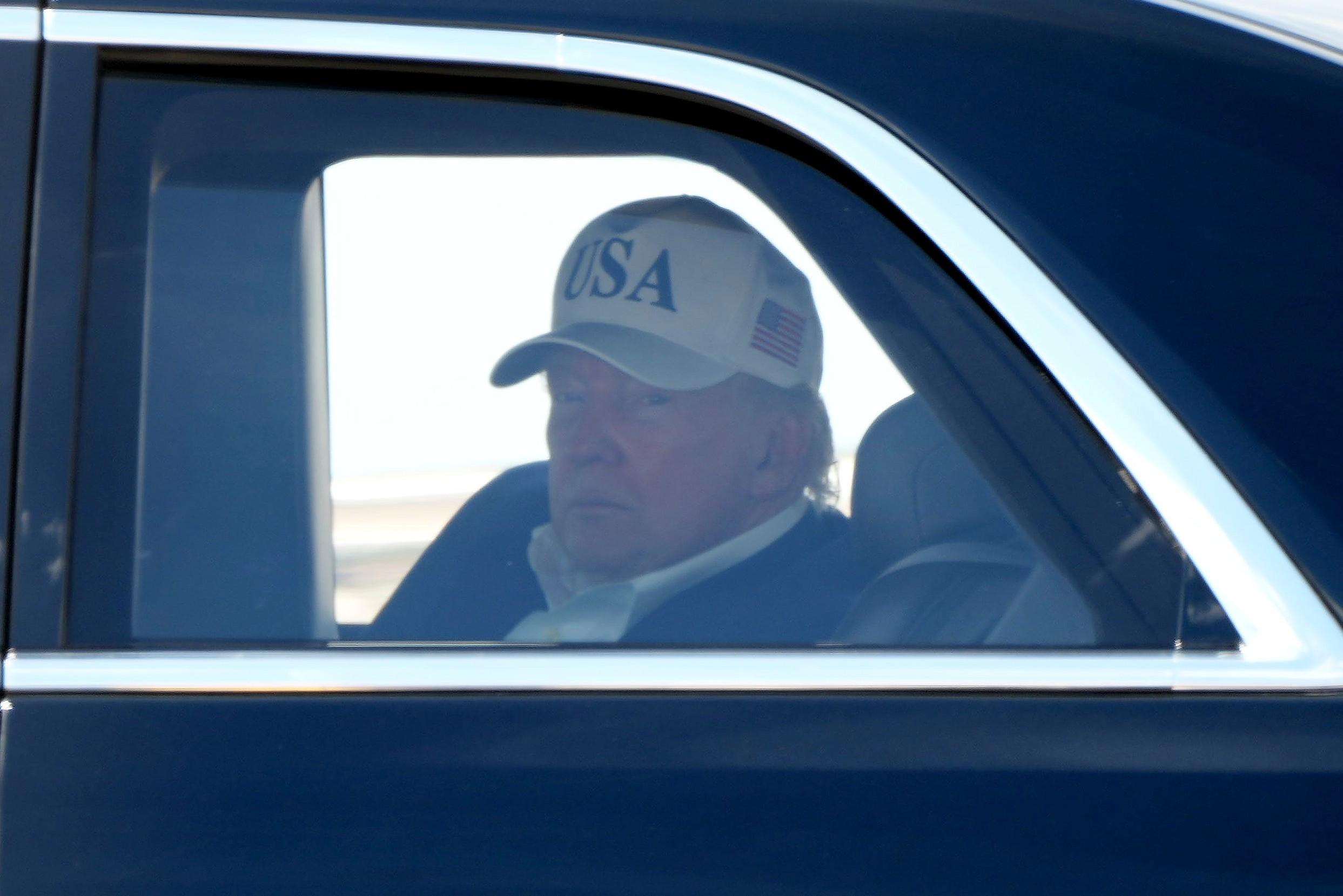 President Donald Trump sits in his limousine, known as The Beast, after arriving on Marine One at Joint Base Andrews, Md., Sunday, June 21, 2026, following a trip to Camp David. (AP Photo/Mark Schiefelbein)