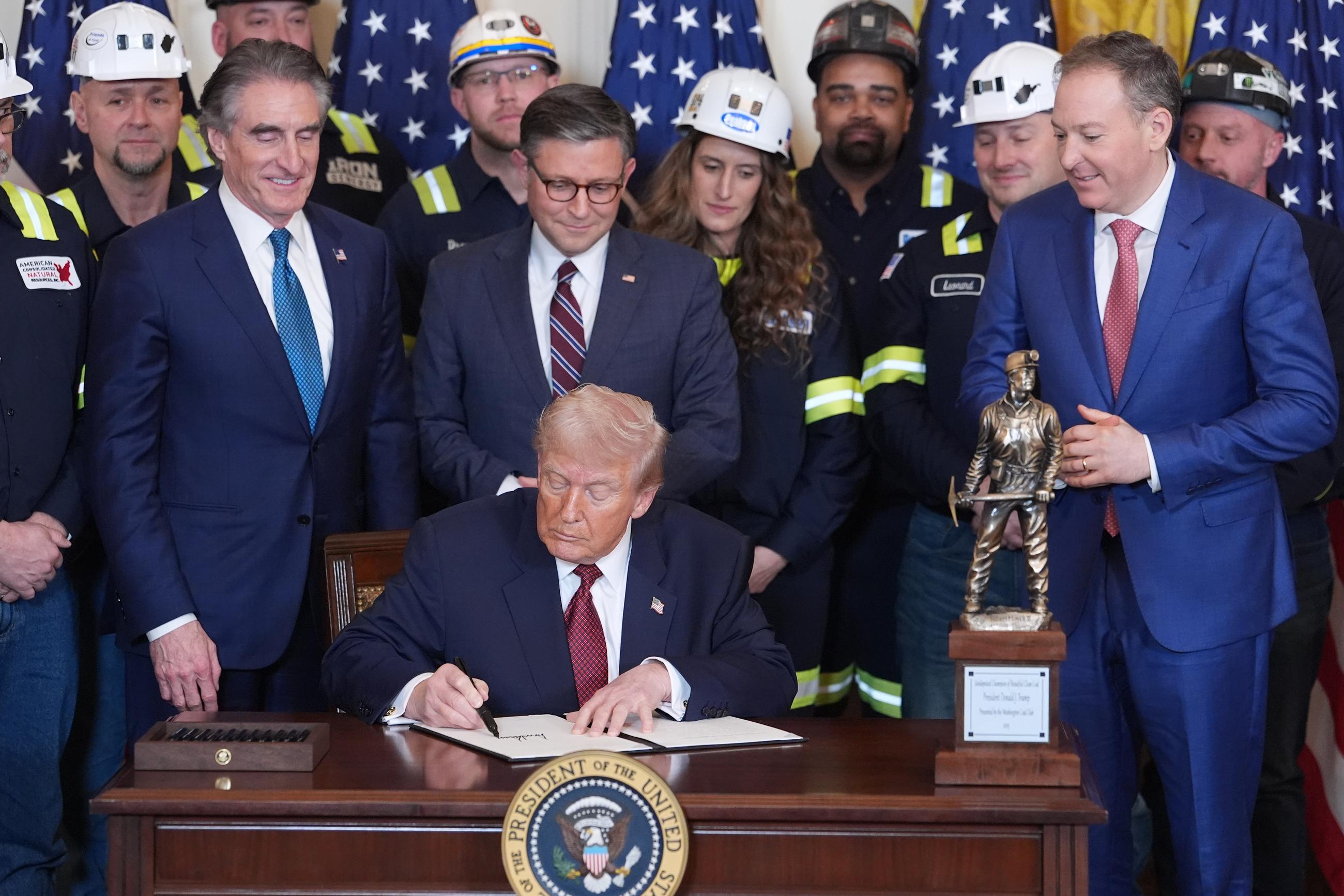 President Trump signs an executive order promoting coal during an event in the East Room of the White House on Feb. 11. (AP Photo/Evan Vucci)