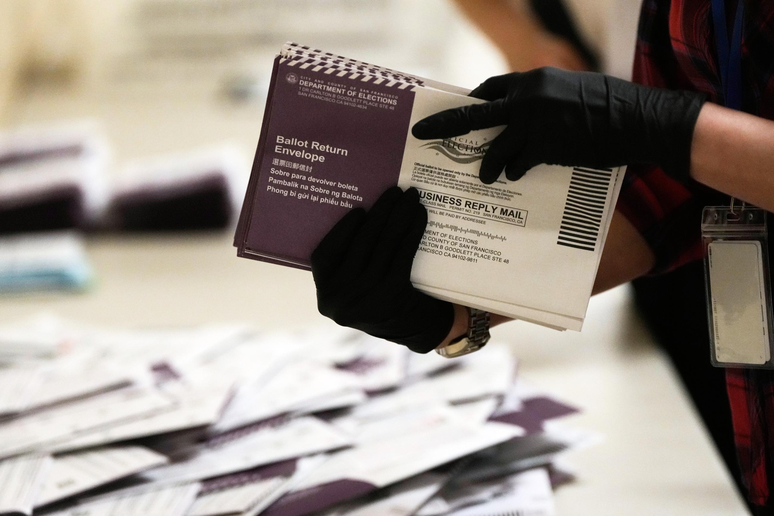 FILE - Department of Elections workers sort mail-in ballots for the California primary election at City Hall on Tuesday, June 2, 2026, in San Francisco. (AP Photo/Jeff Chiu, File)