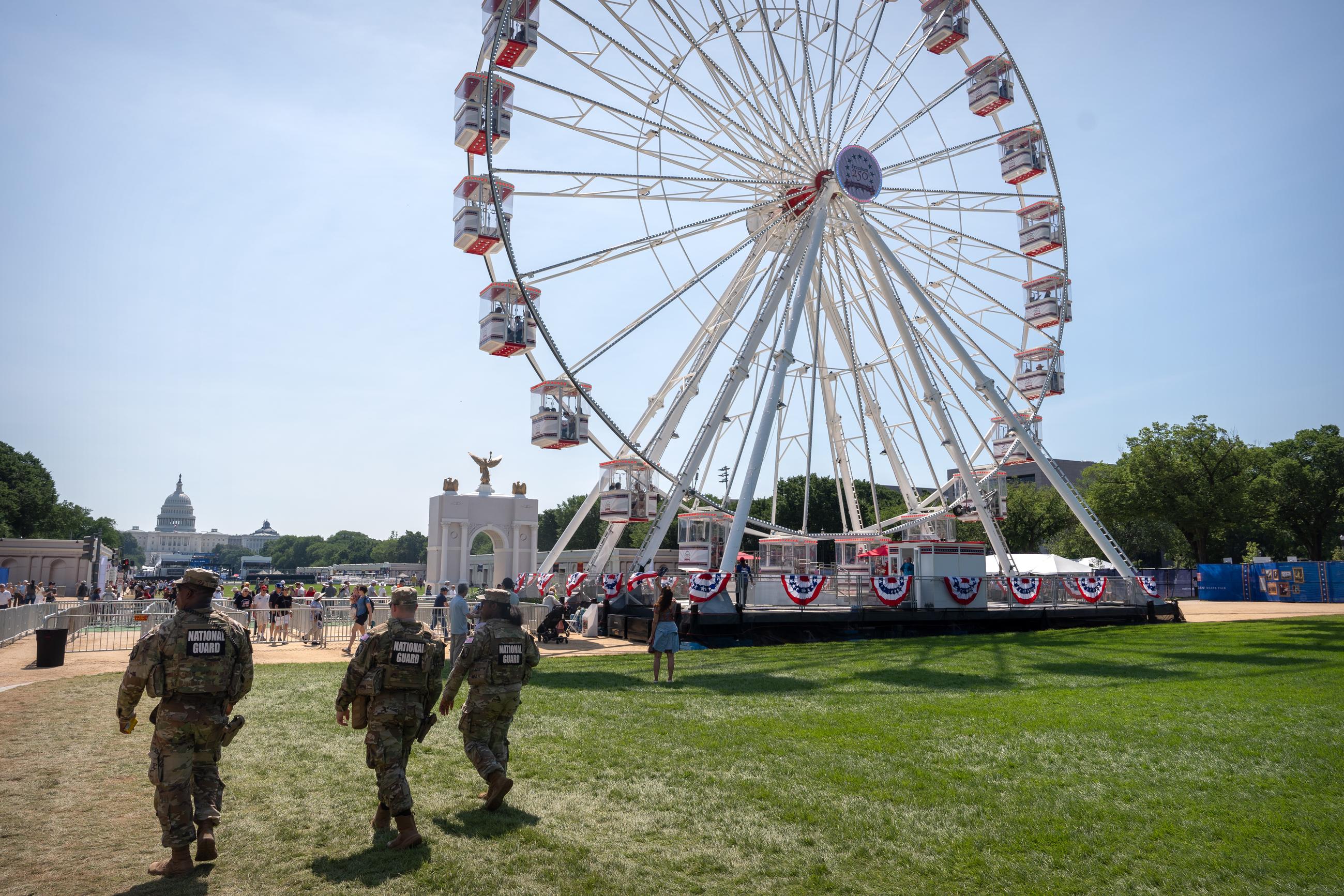 National Guard members patrol the Great American State Fair on the National Mall on Tuesday. (AP Photo/Mark Schiefelbein)