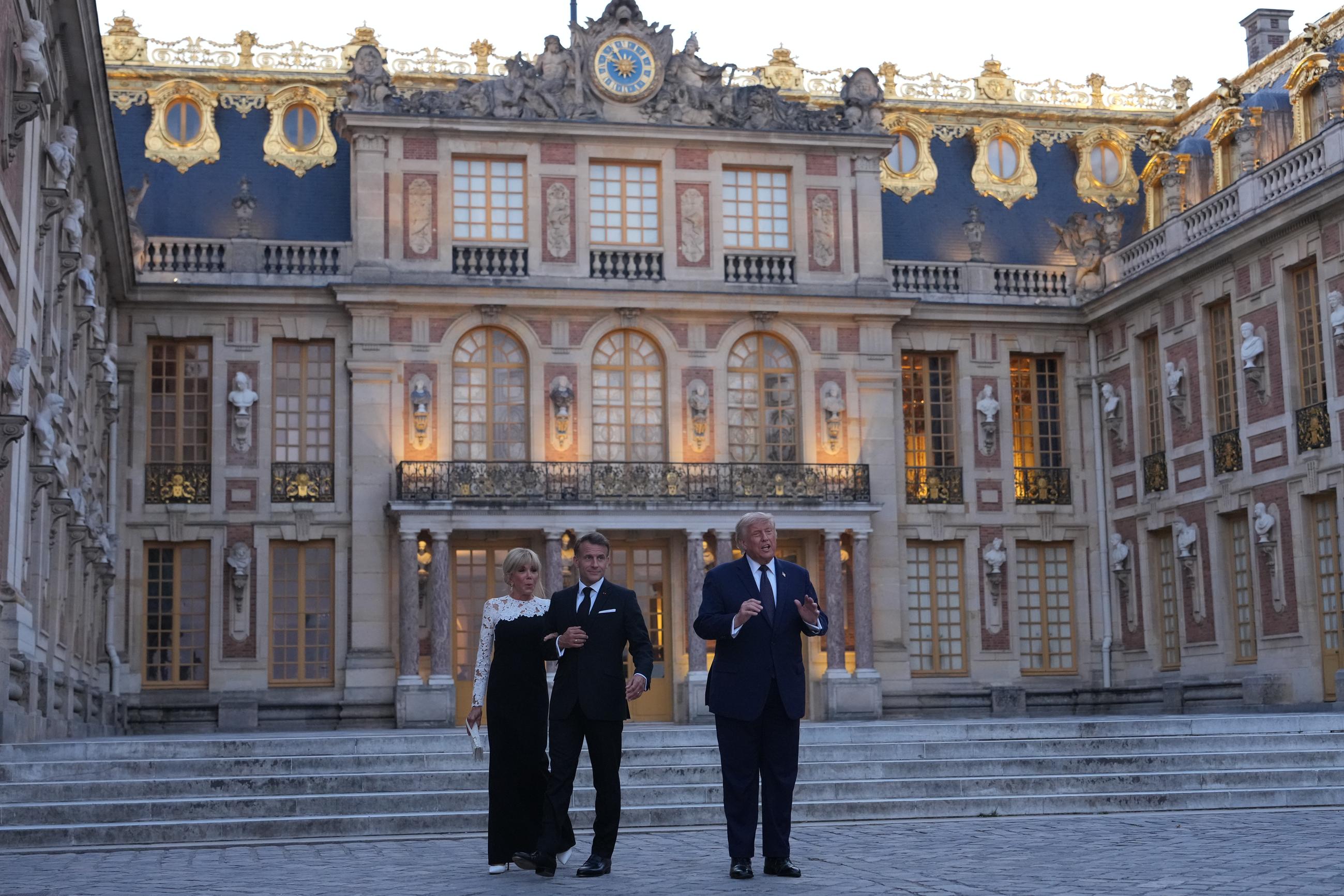 Trump is greeted by French President Emmanuel Macron and first lady Brigitte Macron at the Palace of Versailles in France on June 17.