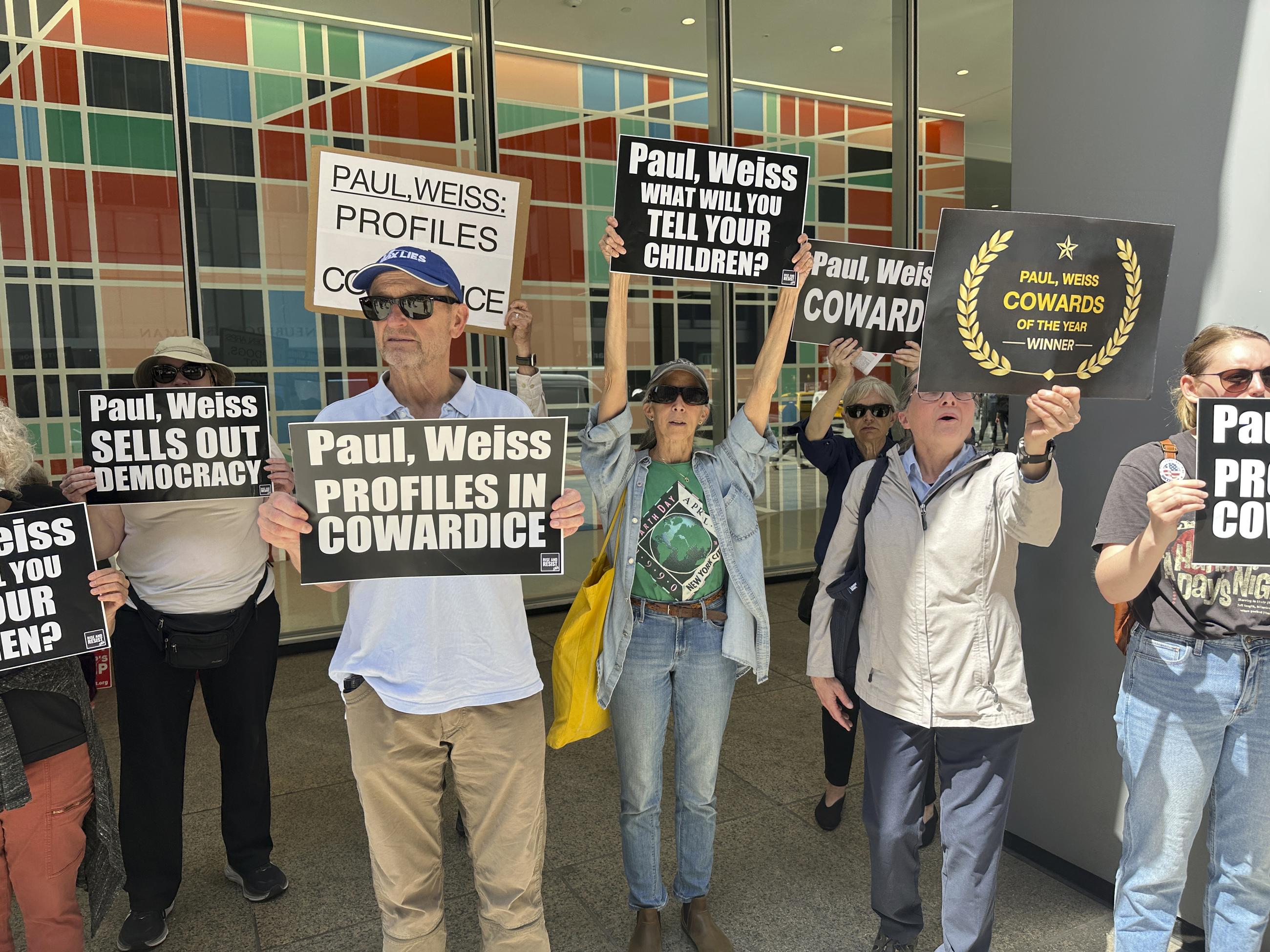 Demonstrators outside the law offices of Paul, Weiss in New York in April 2025 protesting the firm's agreement to do free legal services for the Trump administration (AP Photo/Ted Shaffrey)