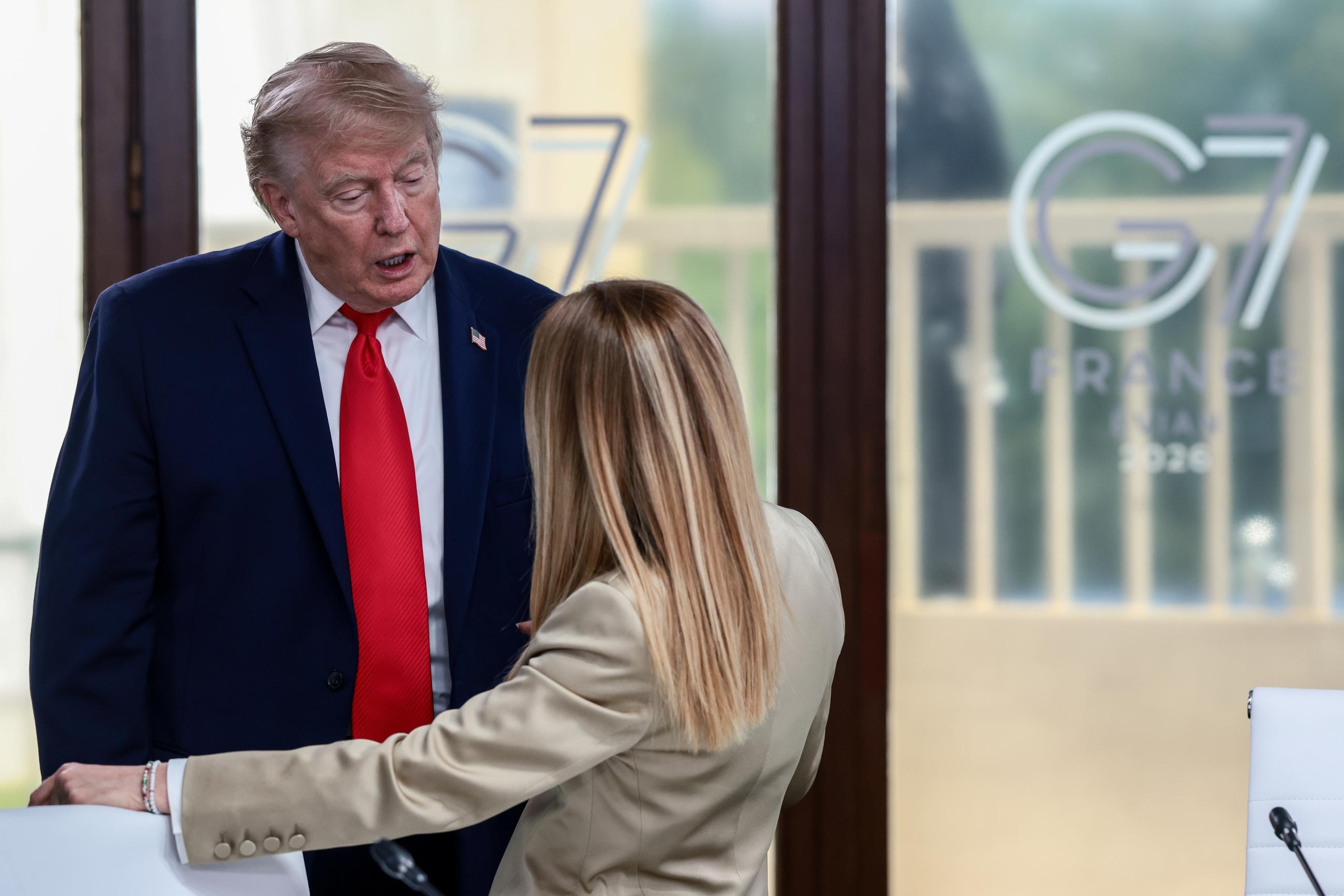 President Trump speaks with Italian Prime Minister Giorgia Meloni at a working lunch with leaders of G-7 and the Middle East in Evian-les-Bains, France, on June 16. (Evelyn Hockstein/Pool Photo via AP, File)