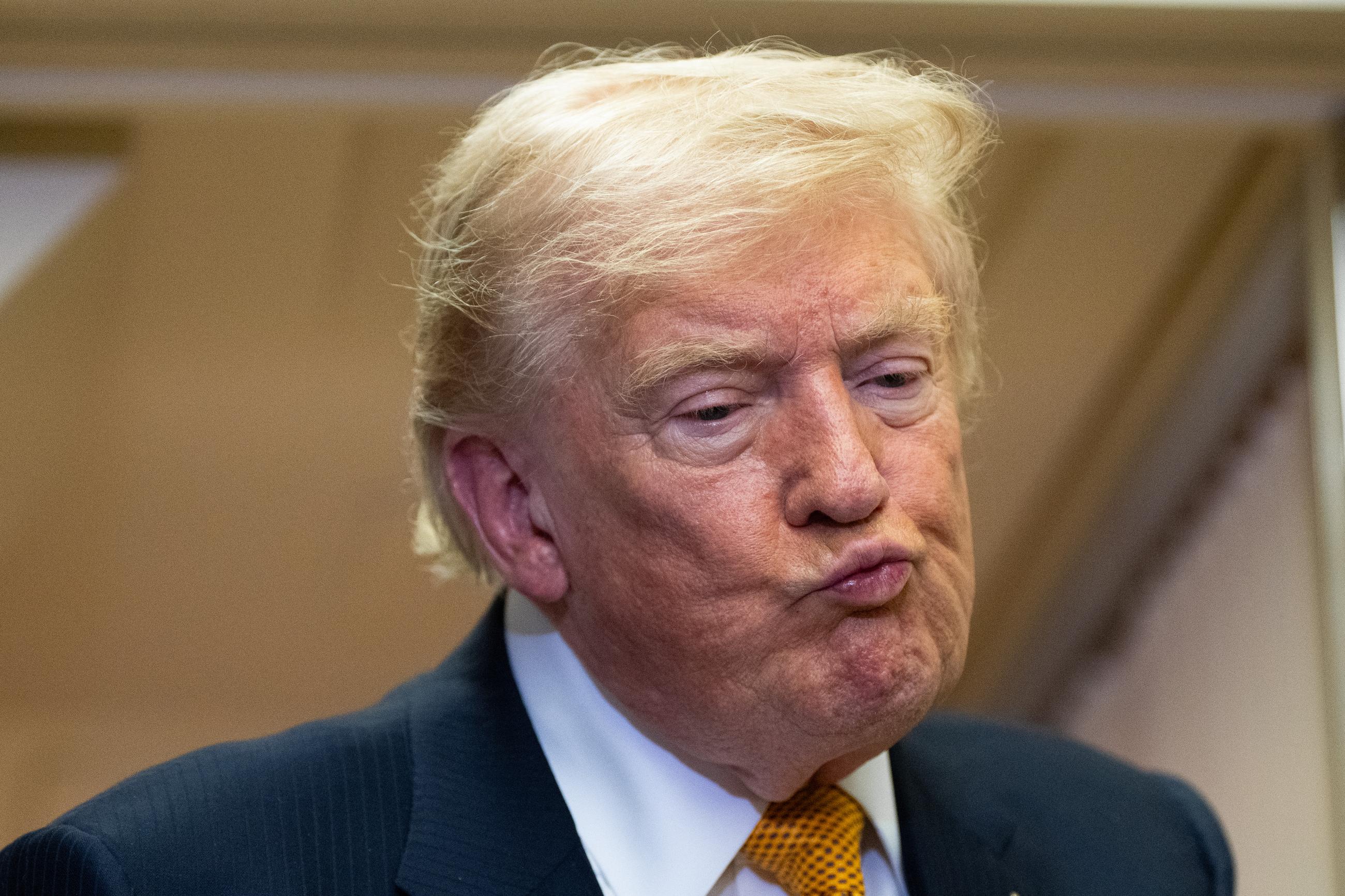 President Donald Trump listens to a question as he speaks with reporters in flight on Air Force One after landing at U.S. Air Force Base at RAF Mildenhall, in Suffolk, Eastern England, Wednesday, July 8, 2026. (AP Photo/Alex Brandon)