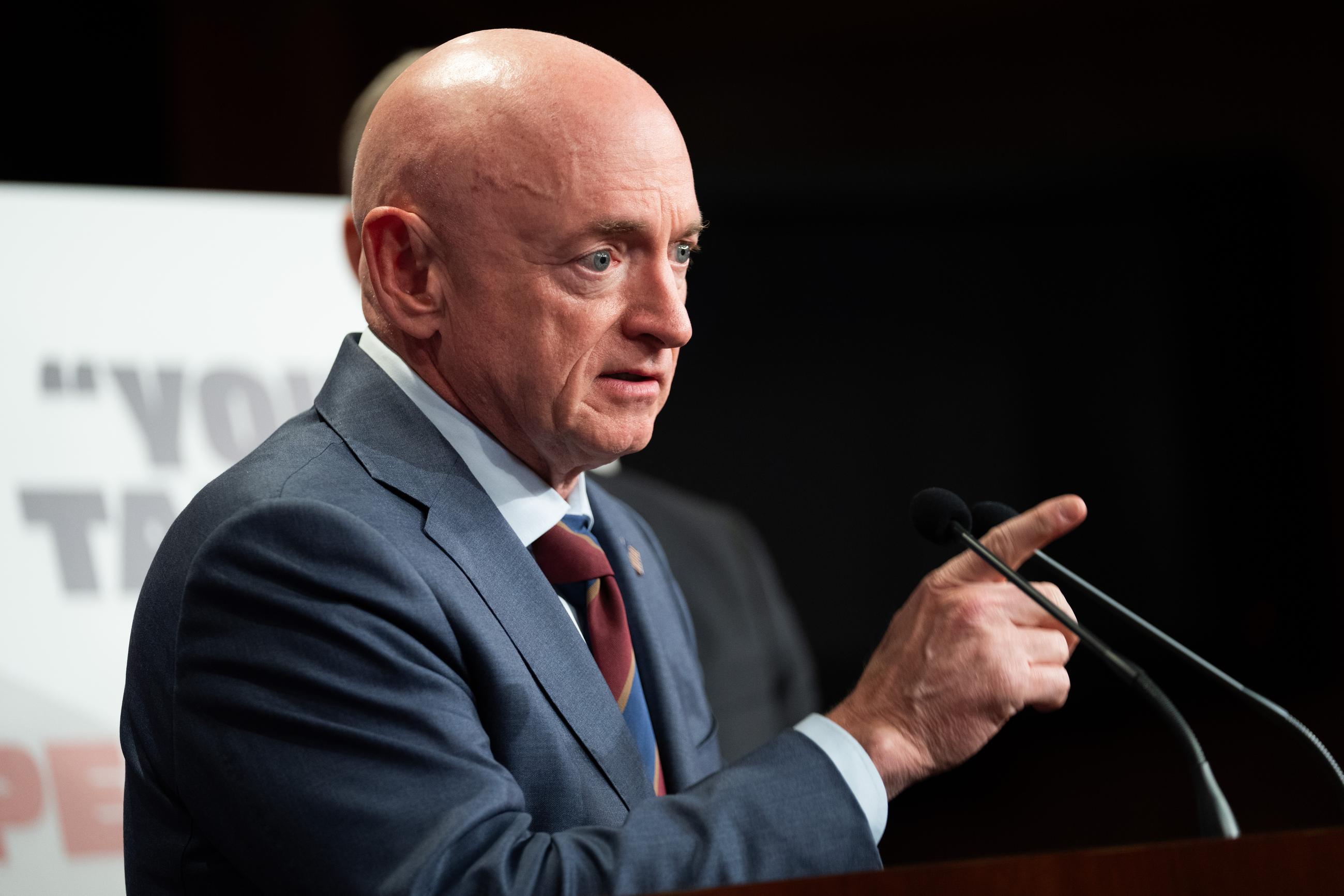 Sen. Mark Kelly, D-Ariz., speaks at a press conference about the introduction of the Drain the Slush Fund Act, Monday, June 1, 2026, in Washington. (AP Photo/Allison Robbert)