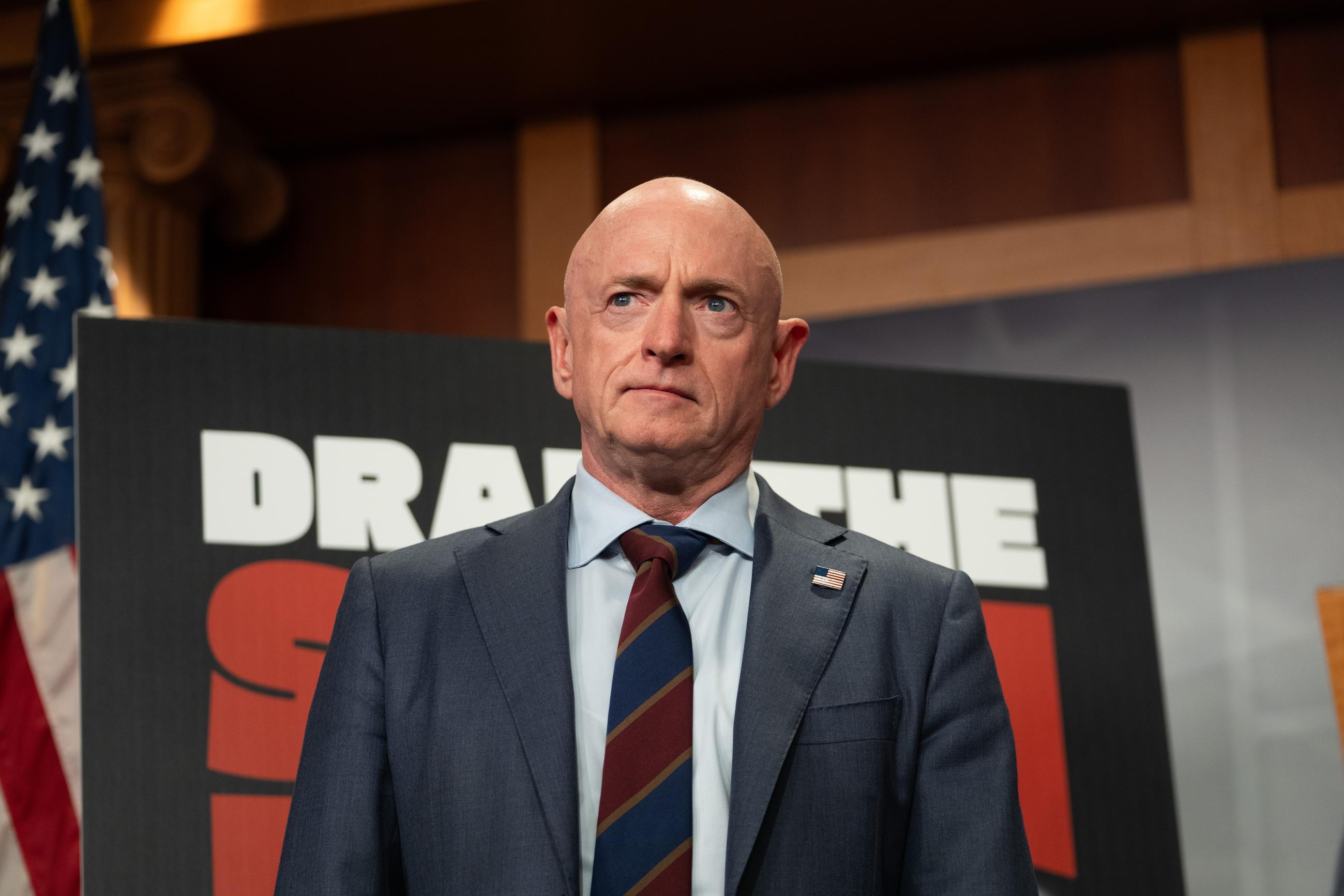 Sen. Mark Kelly, D-Ariz., attends a press conference about the introduction of the Drain the Slush Fund Act, Monday, June 1, 2026, in Washington. (AP Photo/Allison Robbert)