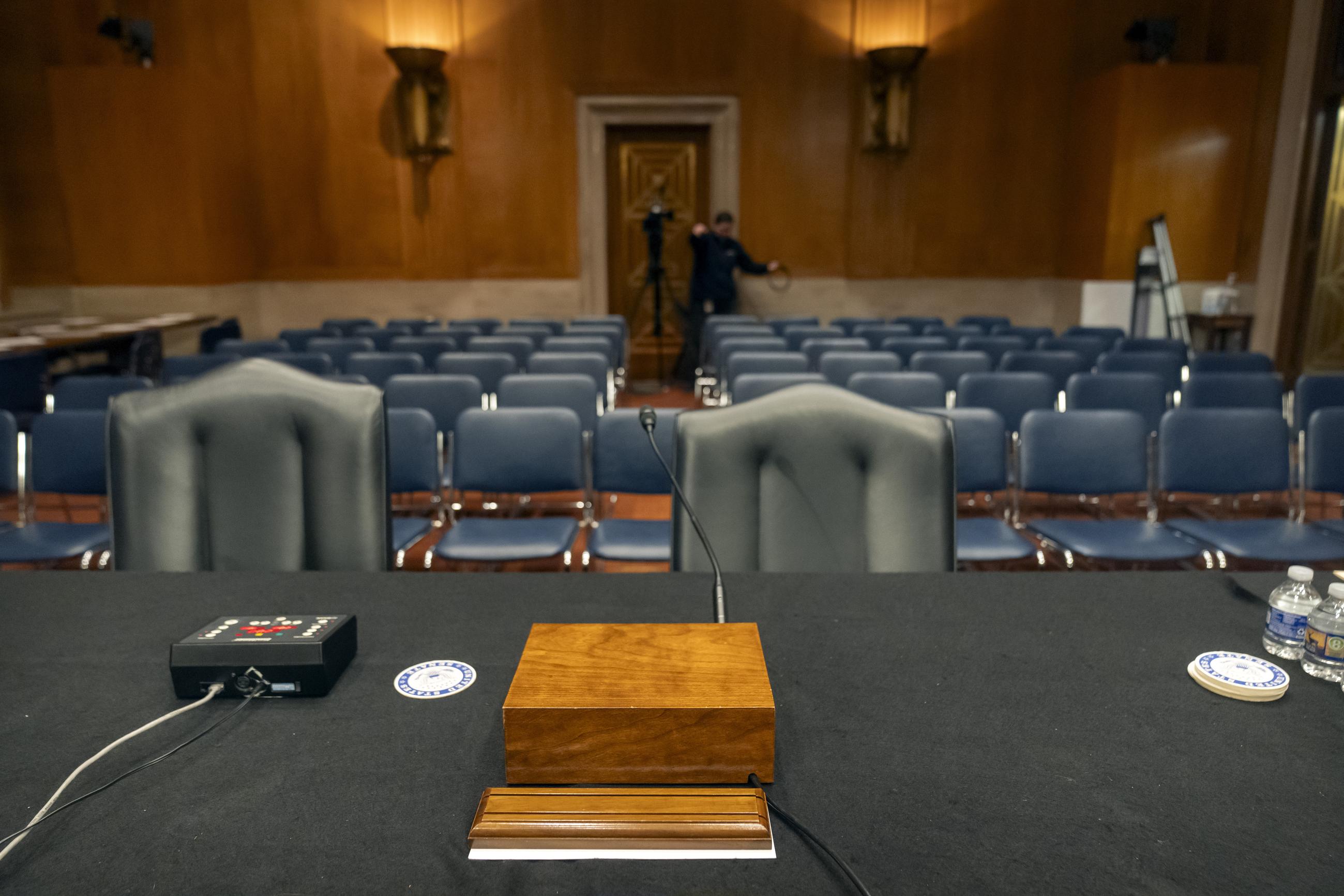 An empty witness table is seen at a Senate hearing room after a hearing was canceled to discuss the nomination of former Rep. Dave Weldon to head the Centers for Disease Control and Prevention on March 13, 2025. The nomination was pulled by the White House shortly before the hearing was to take place. (AP Photo/Mark Schiefelbein)