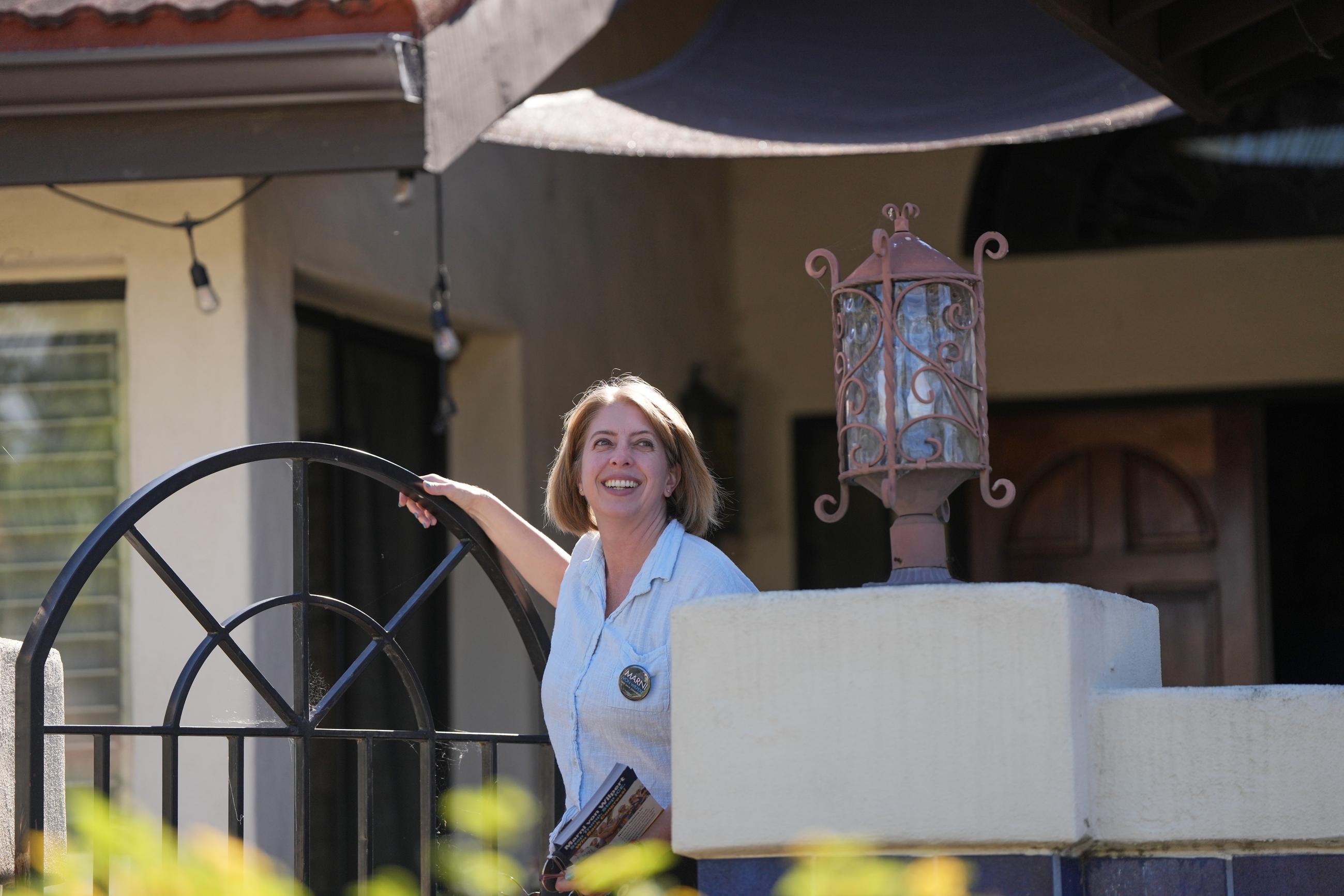 Marni von Wilpert, a Democratic candidate for California's 48th Congressional District, canvasses in a neighborhood Friday, May 29, 2026, in San Marcos, Calif. (AP Photo/Gregory Bull)