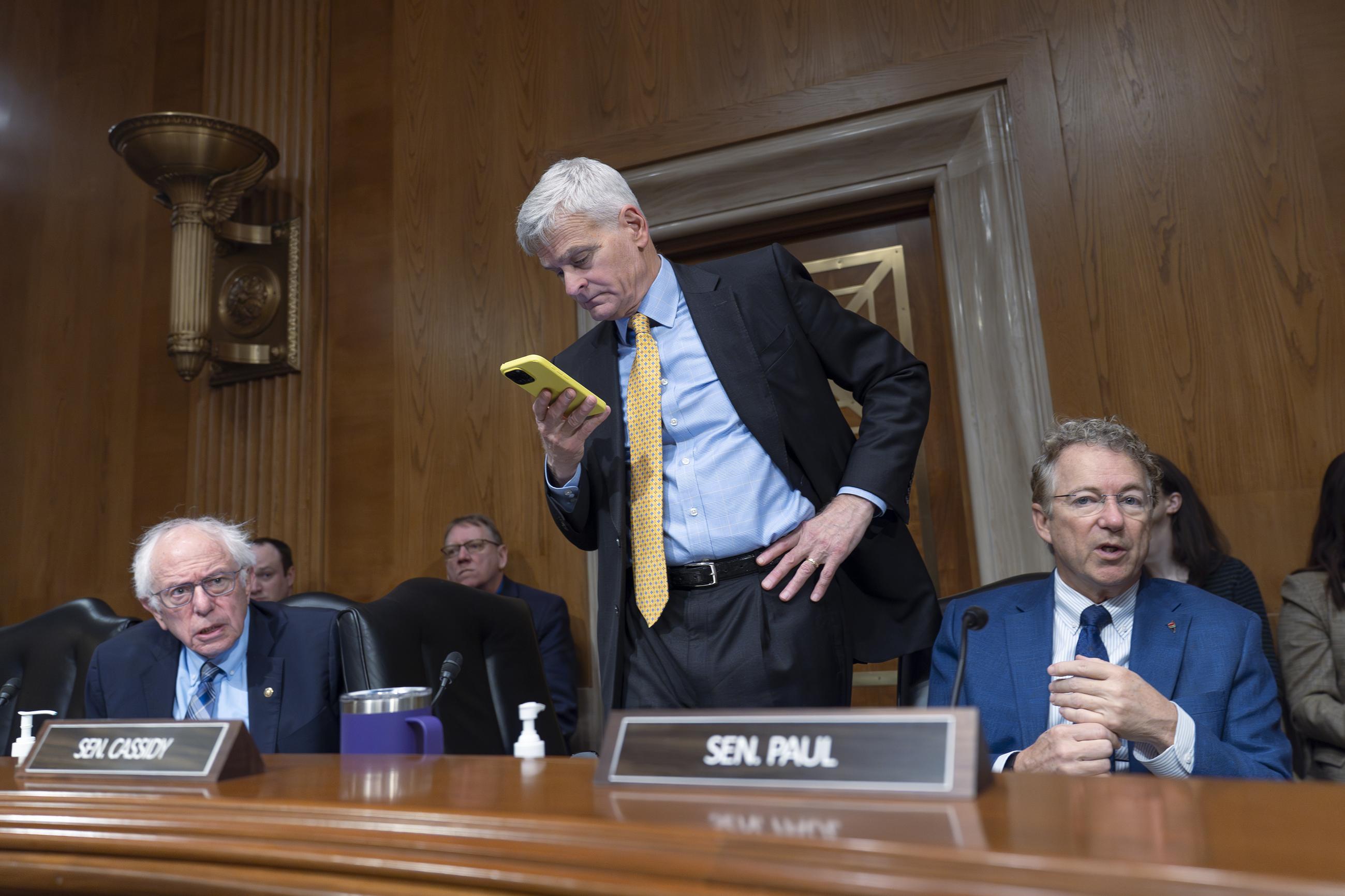 Cassidy with HELP Committee ranking member Bernie Sanders and Sen. Rand Paul (AP Photo/J. Scott Applewhite)