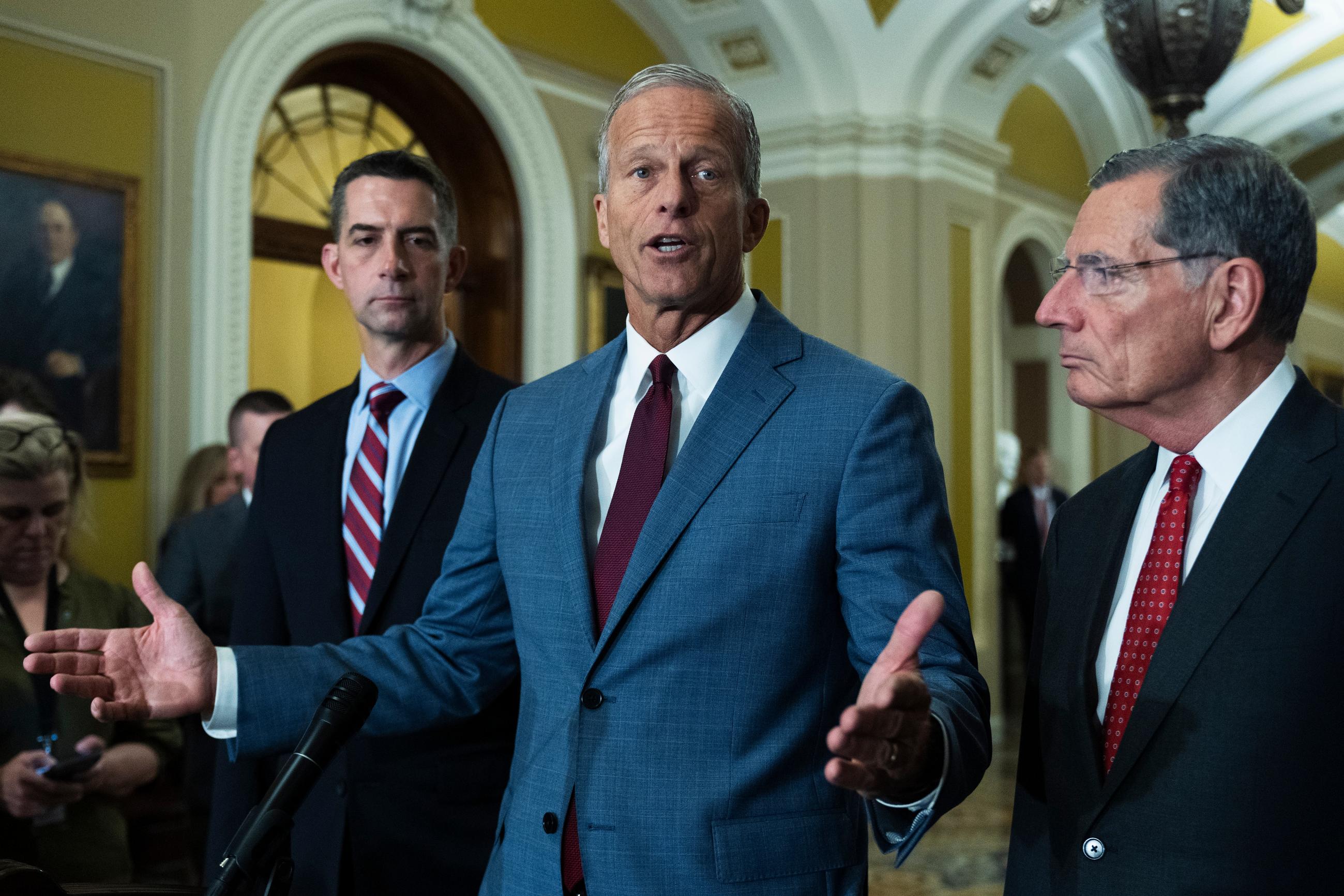 Senate Majority Leader John Thune, R-S.D., with Sen. Tom Cotton, R-Ark. left; and Sen. John Barasso, R-Wyo., speaks to reporters on Capitol Hill in Washington, Wednesday, July 29, 2026, in Washington. (AP Photo/Manuel Balce Ceneta)