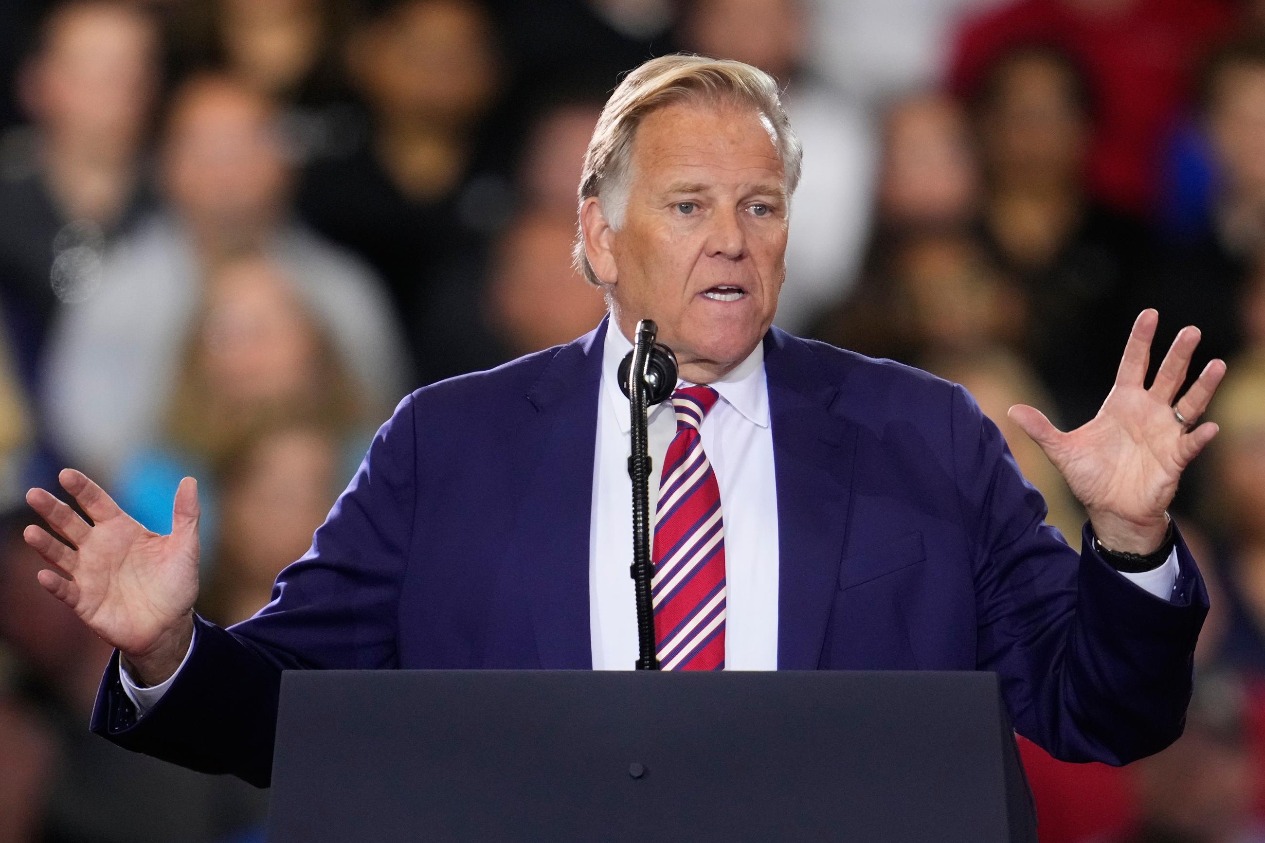 Republican Senate candidate Mike Rogers speaks before President Donald Trump at an event at the General Motors Proving Ground Monday, July 27, 2026, in Milford, Mich. (AP Photo/Paul Sancya)