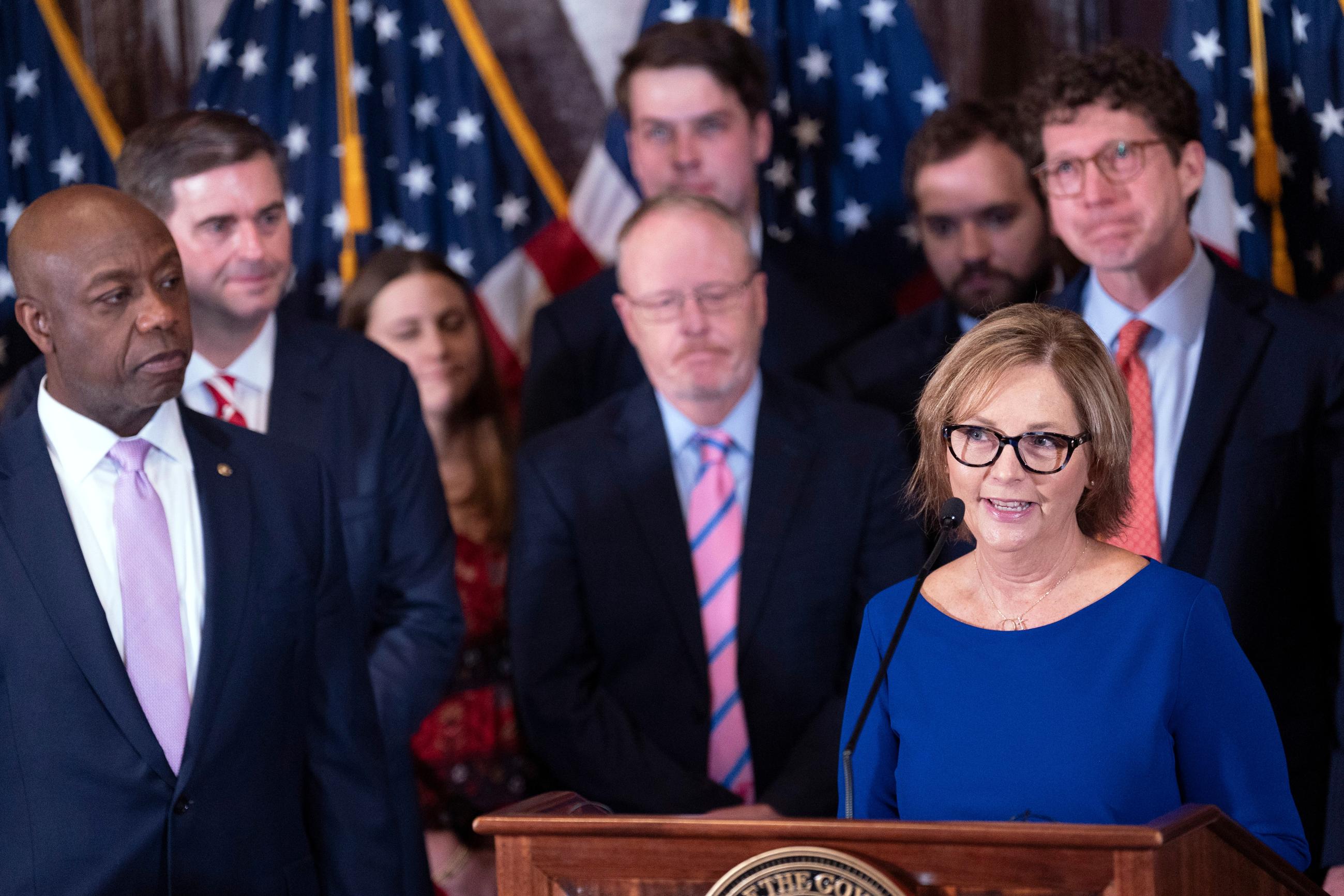 Newly-appointed U.S. interim Senator Darline Graham Nordone, right, with Sen. Tim Scott, R-S.C., left, speaks during a press conference announcing her appointment to fill the vacancy created by the passing of her brother, U.S. Sen. Lindsey Graham, at the statehouse Monday, July 13, 2026, in Columbia, S.C. (AP Photo/Sean Rayford)