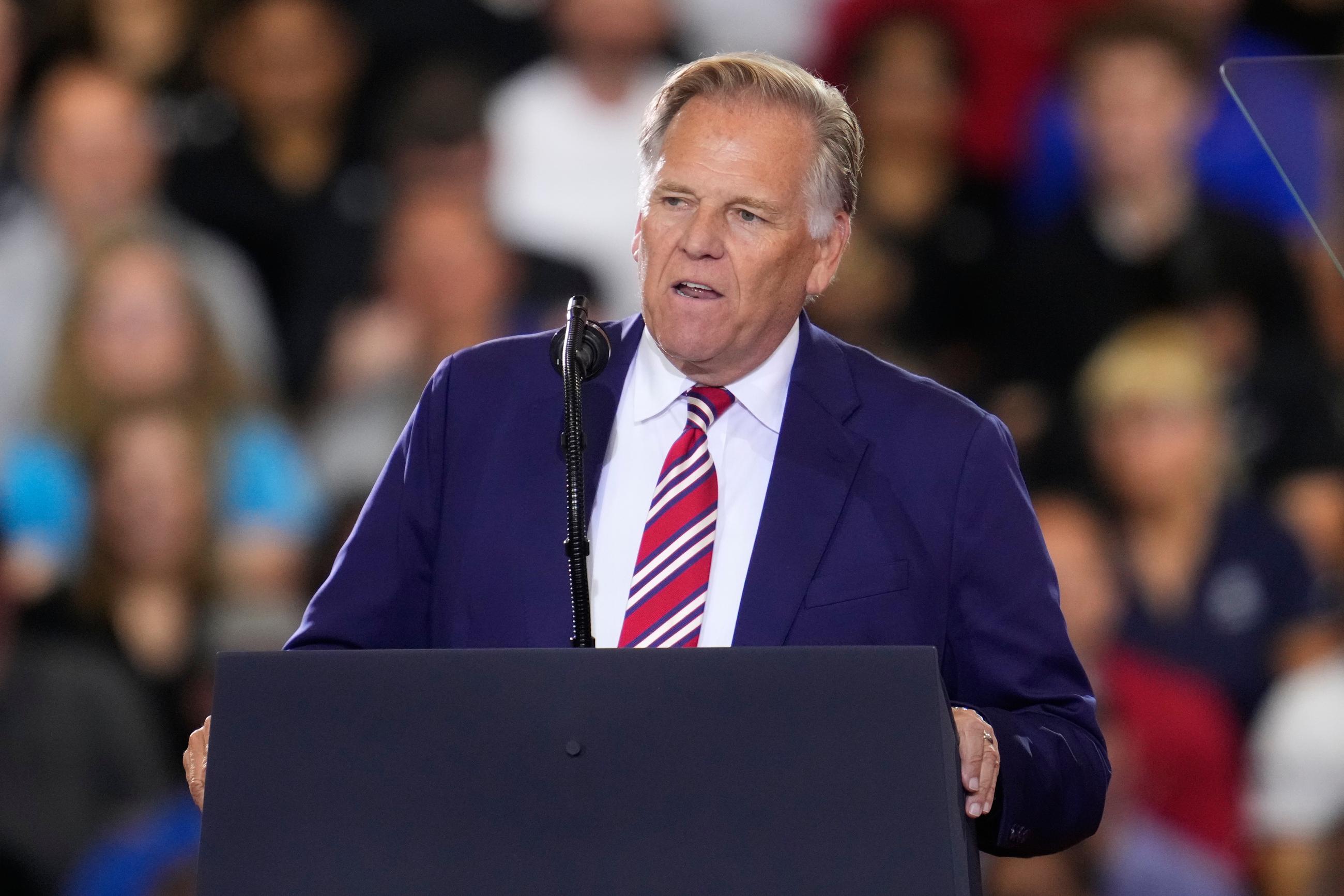 Republican Senate candidate Mike Rogers speaks before President Donald Trump at an event at the General Motors Proving Ground Monday, July 27, 2026, in Milford, Mich. (AP Photo/Paul Sancya)
