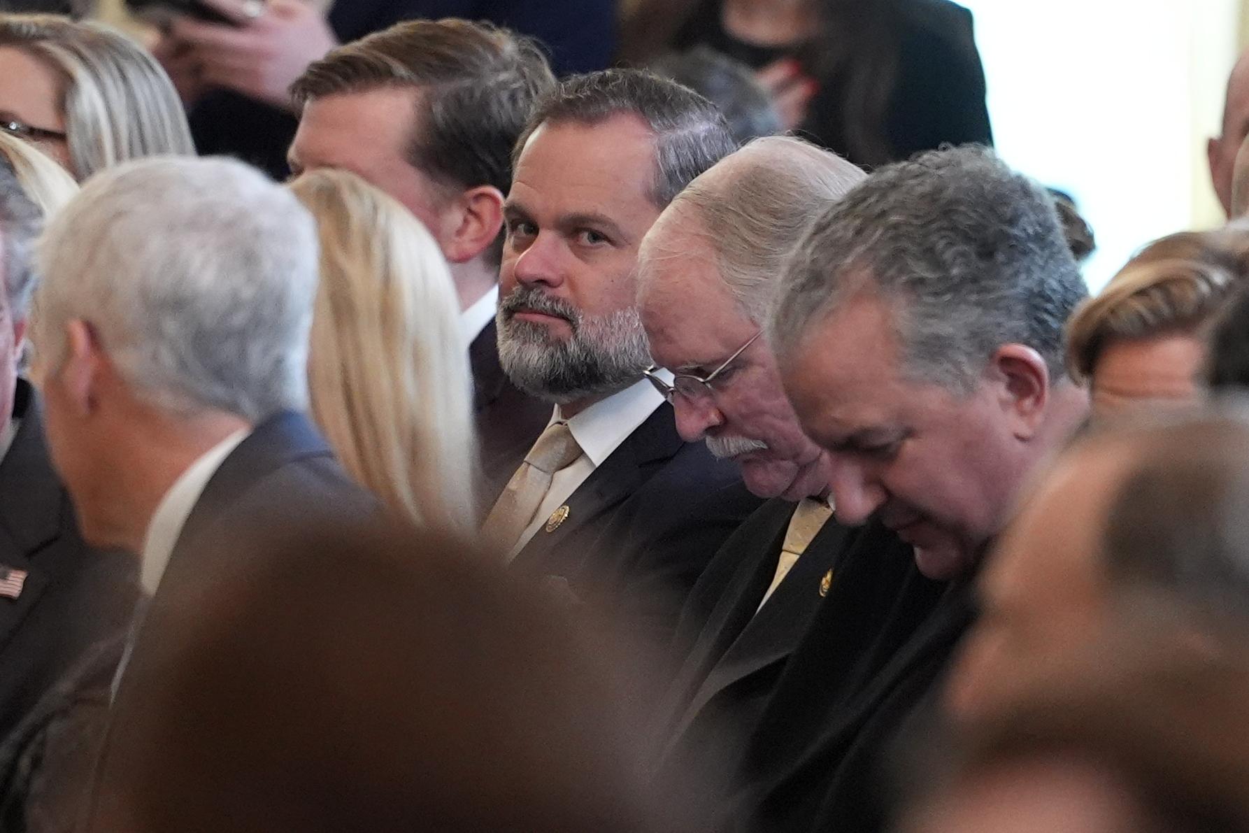 Rep. Cory Mills, R-Fla., center, arrives before President Donald Trump speaks during an event to honor the 2025 Stanley Cup Champion Florida Panthers in the East Room of the White House, Thursday, Jan. 15, 2026, in Washington. (AP Photo/Evan Vucci)