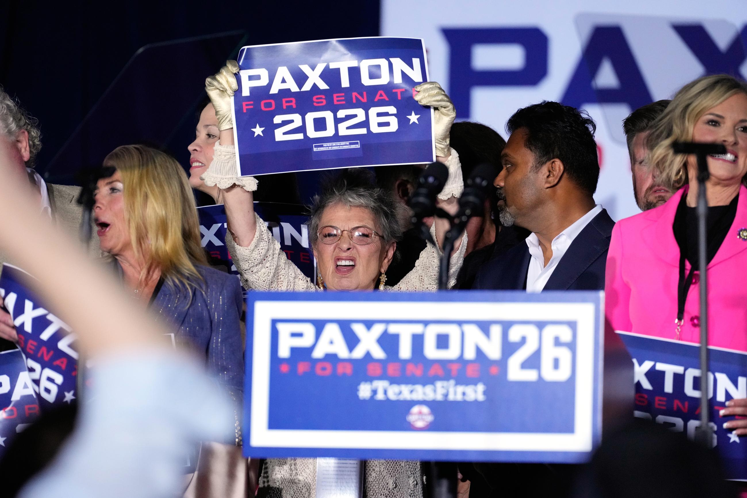 Attendees celebrate at an event in Plano, Texas, after state Attorney General Ken Paxton won the Republican nomination for Senate against Sen. John Cornyn in a primary runoff election on May 26. (AP Photo/Tony Gutierrez)