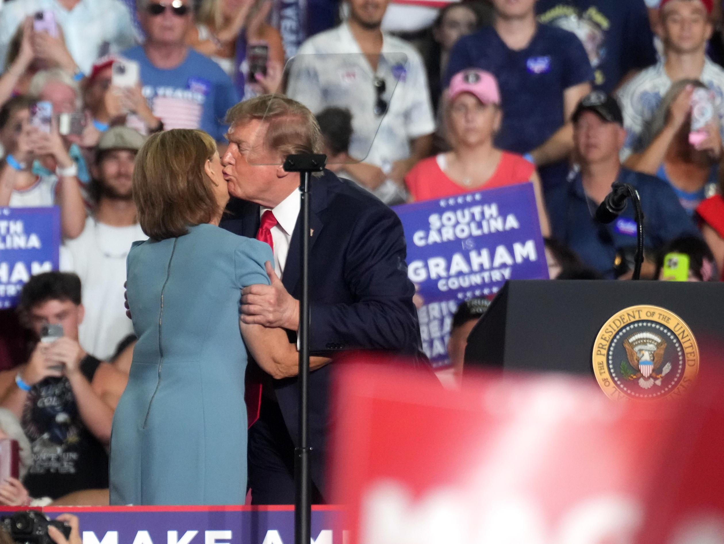 President Trump greets Sen. Darline Graham at a campaign rally in Myrtle Beach, S.C., on Aug. 21. (AP Photo/Meg Kinnard)