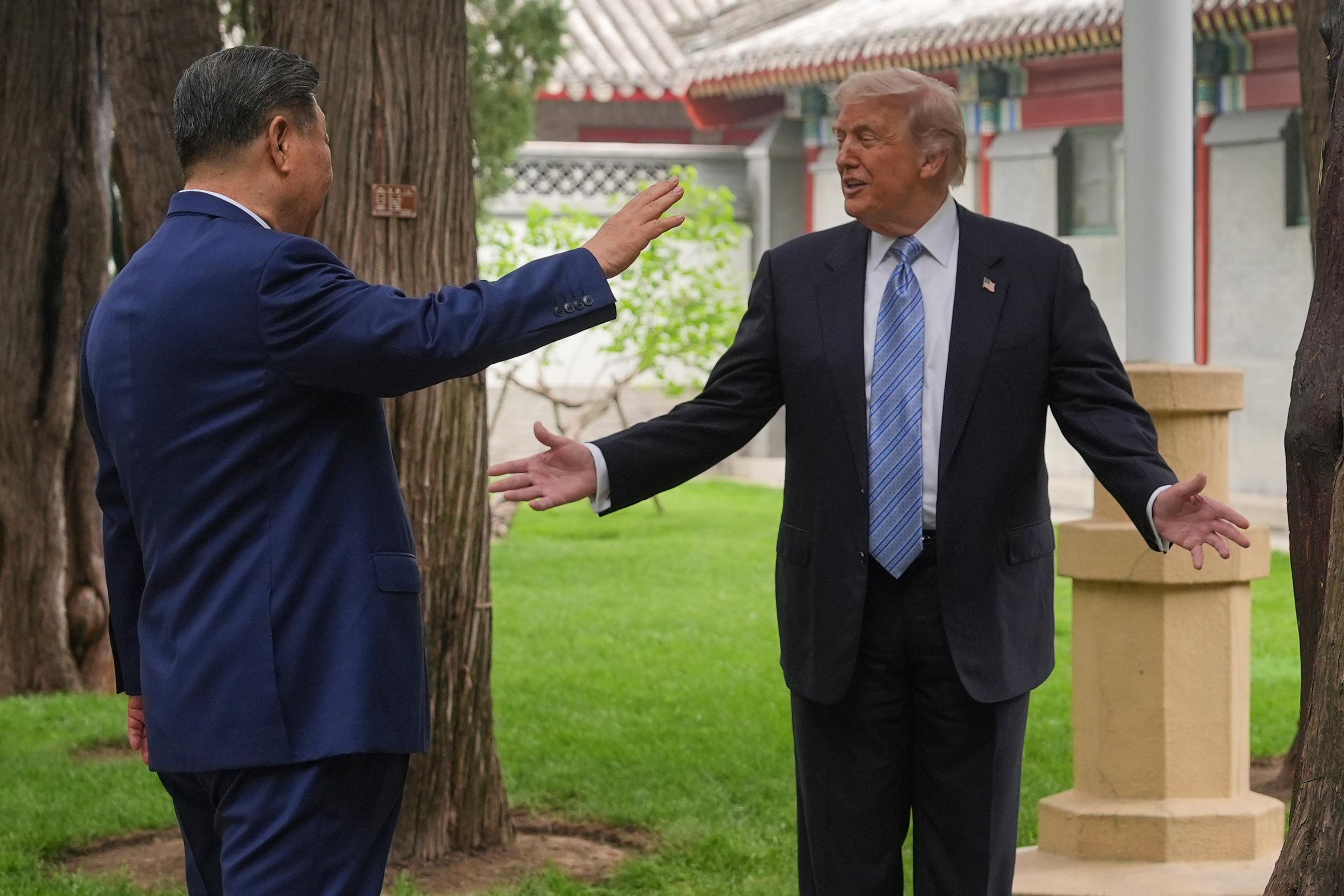 President Trump talks with Chinese President Xi Jinping in Beijing on May 15. (AP Photo/Mark Schiefelbein, Pool)
