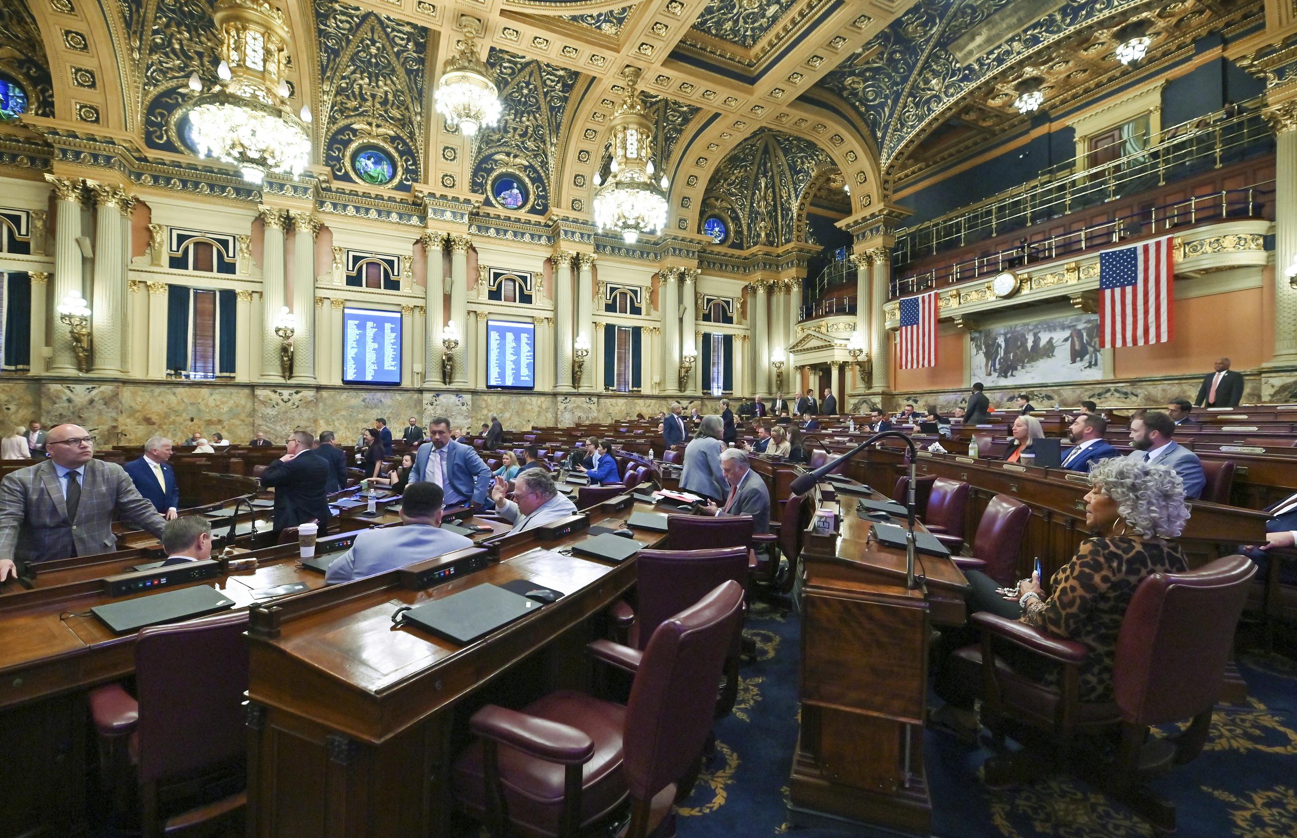 Representatives mill about the House after the Pennsylvania Legislative session in July 2025. (AP Photo/Aimee Dilger)