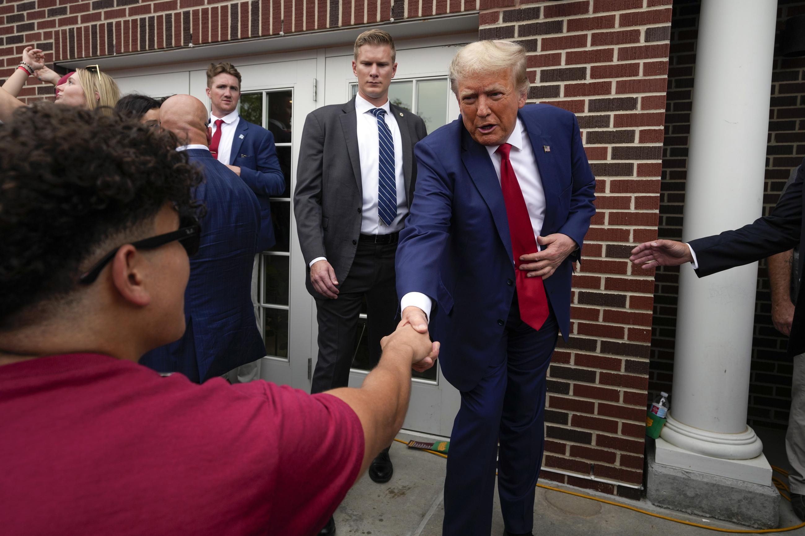 FILE - Former President Donald Trump visits the Alpha Gamma Rho fraternity, at Iowa State University before an NCAA college football game between Iowa State and Iowa, Saturday, Sept. 9, 2023, in Ames, Iowa. (AP Photo/Charlie Neibergall, File)