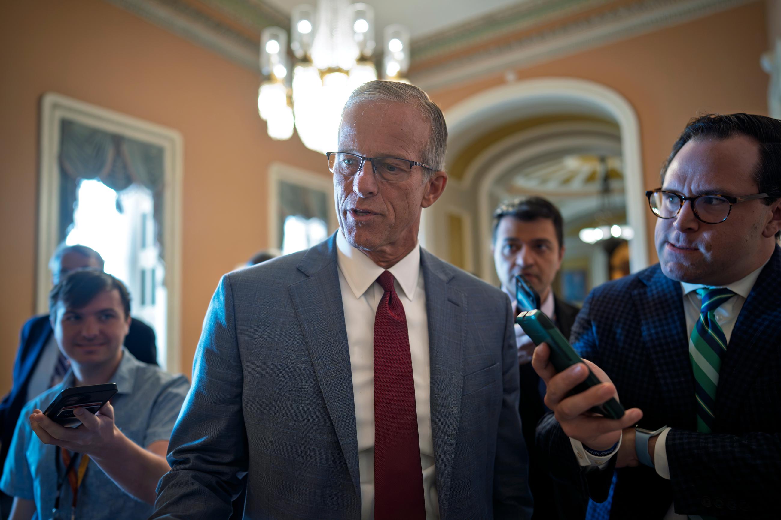 Senate Majority Leader John Thune, R-S.D., walks with reporters as he heads to a closed-door GOP lunch, at the Capitol in Washington, Wednesday, Sept. 30, 2026. (AP Photo/J. Scott Applewhite)