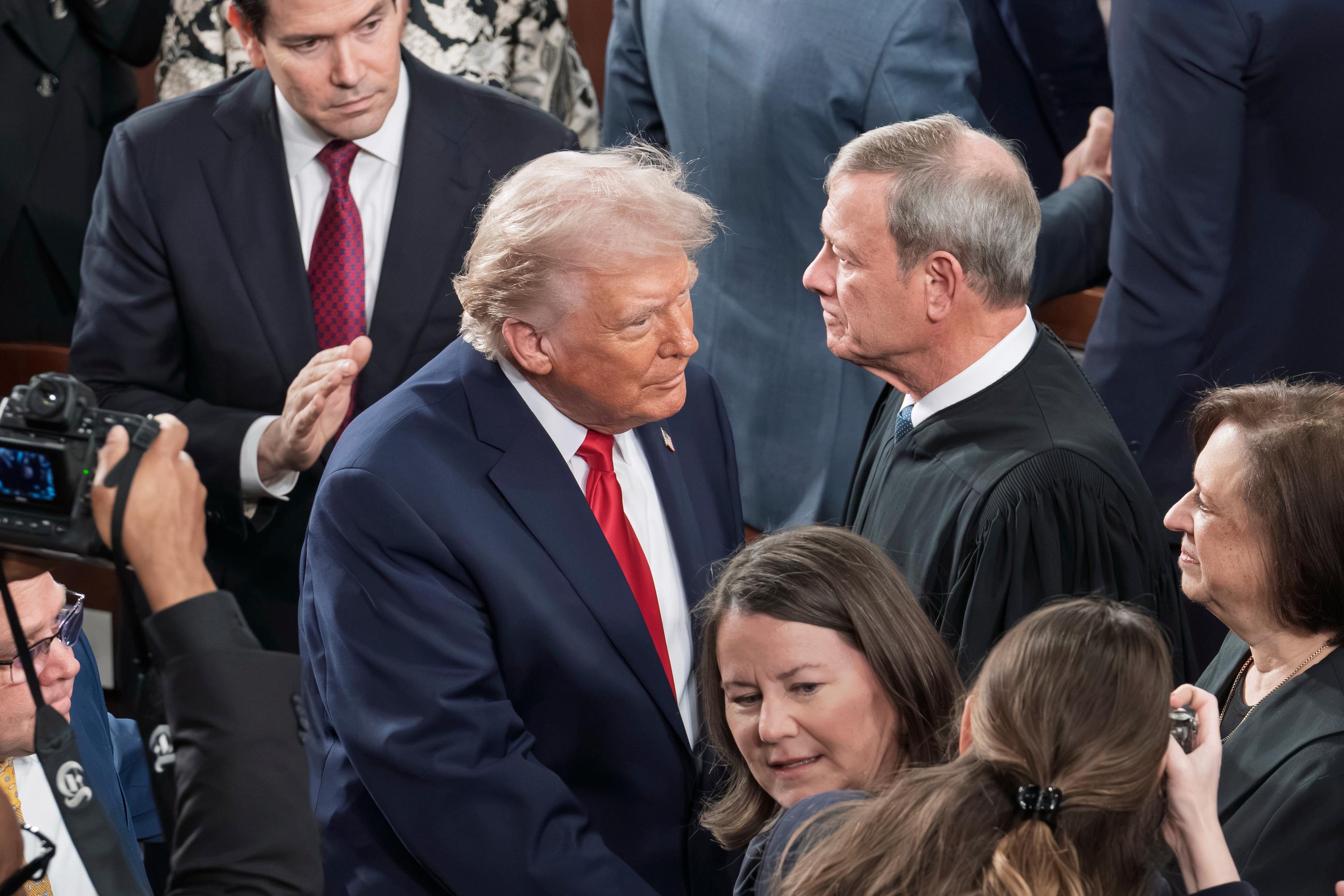 FILE - President Donald Trump is greeted by, from top left, Secretary of State Marco Rubio, Chief Justice of the United States John Roberts, and Associate Justice Elena Kagan, as he arrives to give his State of the Union address to a joint session of Congress, at the Capitol in Washington, Tuesday, Feb. 24, 2026. (AP Photo/J. Scott Applewhite, File)